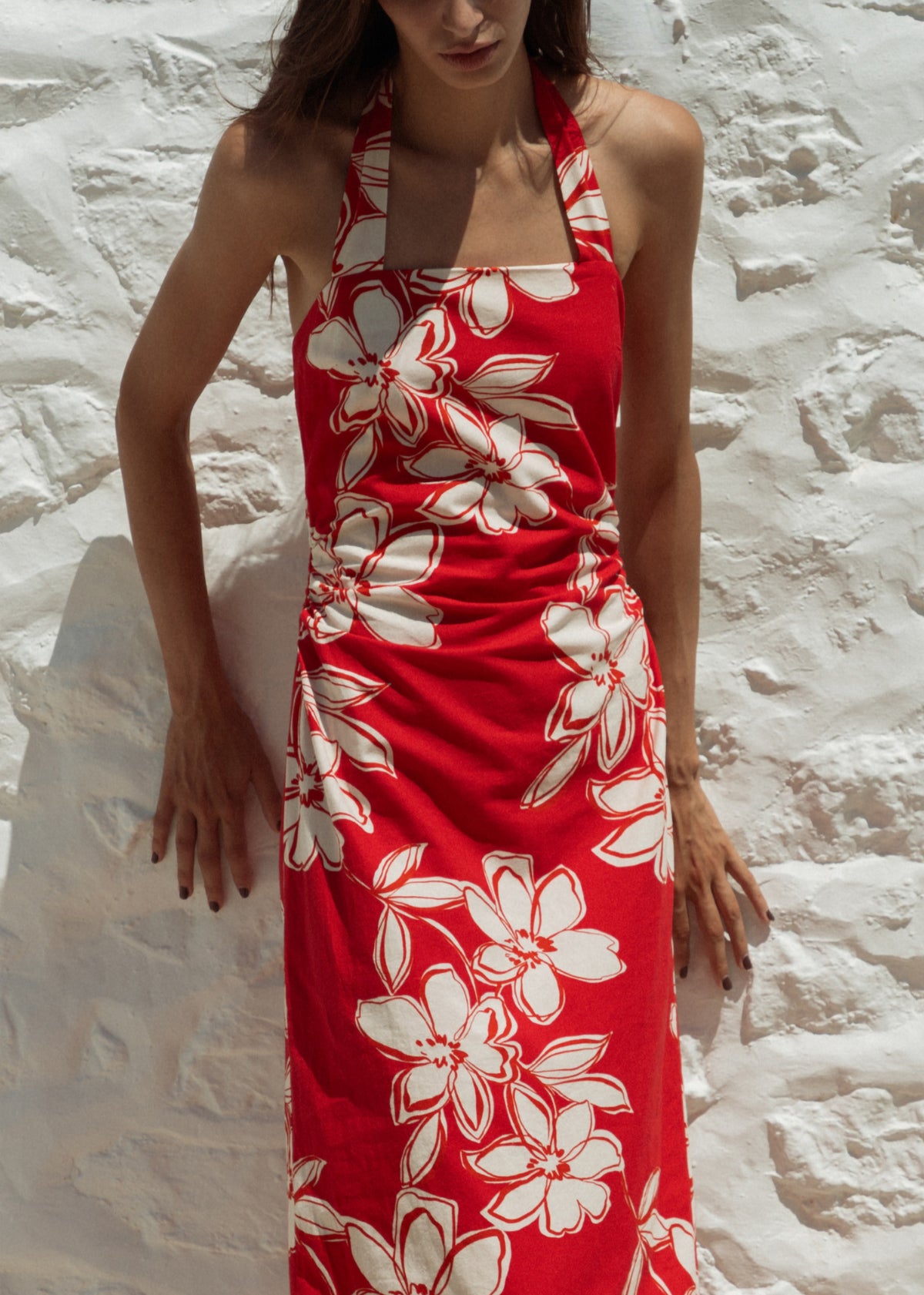Close-up of the Red and White Cotton Floral Halter-Neck Midi Dress, showing a red with white floral print.
