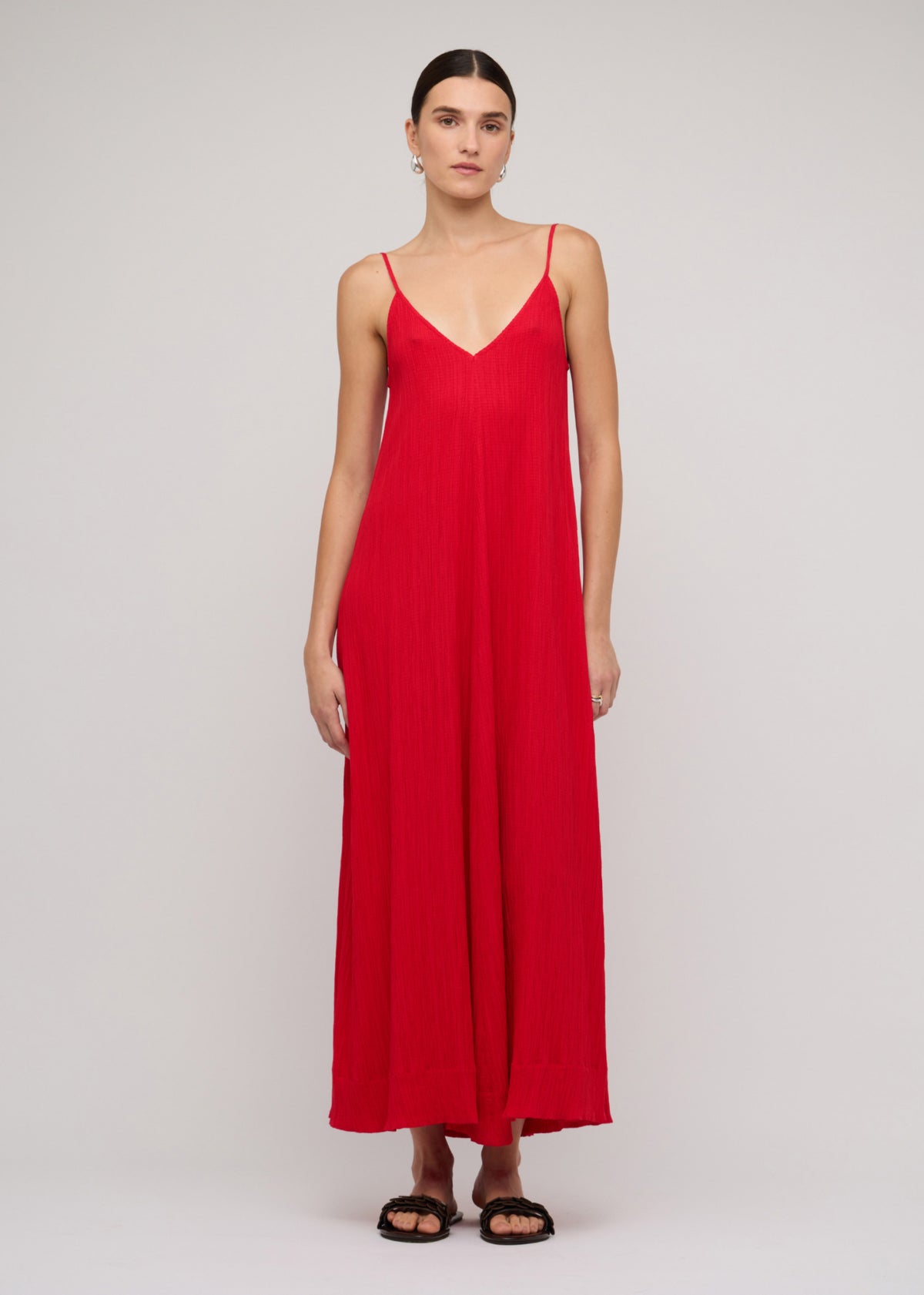 Model wearing Red Crepe V-Neck Floaty Maxi Dress with slim adjustable straps.