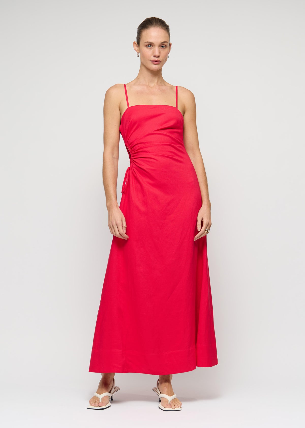 Model wearing Red Linen Blend Cut-Out Maxi Dress with square neckline with thin straps.