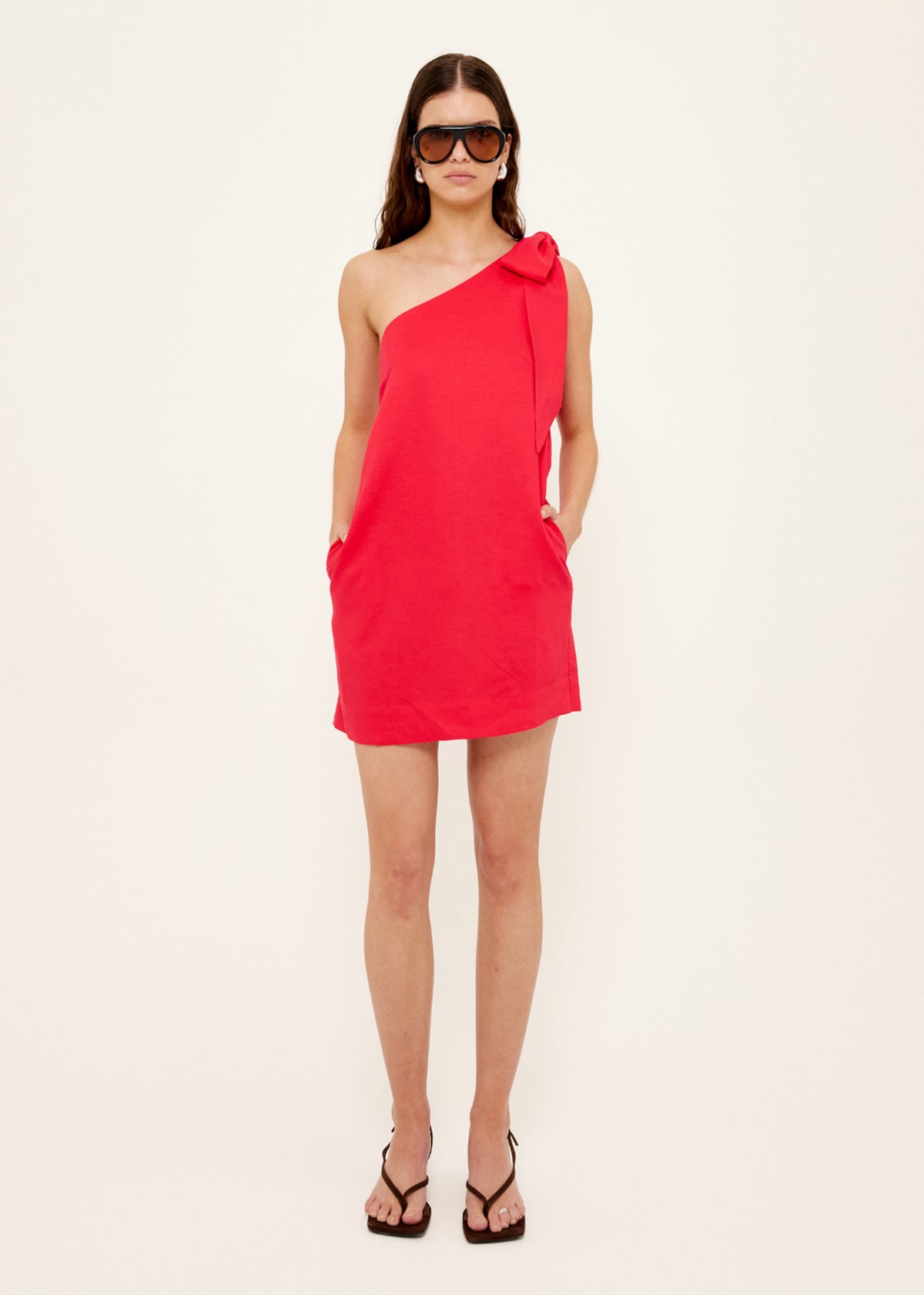 Model wearing Red Linen Blend One Shoulder Mini Dress with a relaxed A-line silhouette and a fully lined.