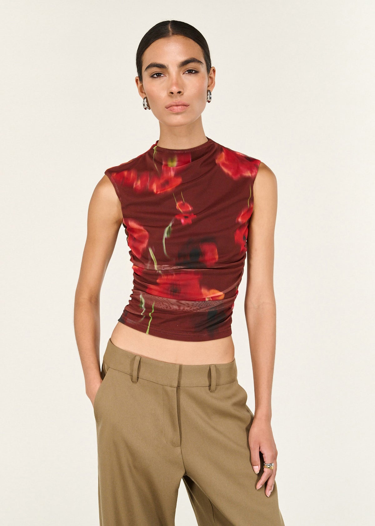 Close-up of the Red Poppy Print Mesh Tank, showing a high neckline silhouette and a stretch mesh fabrication.