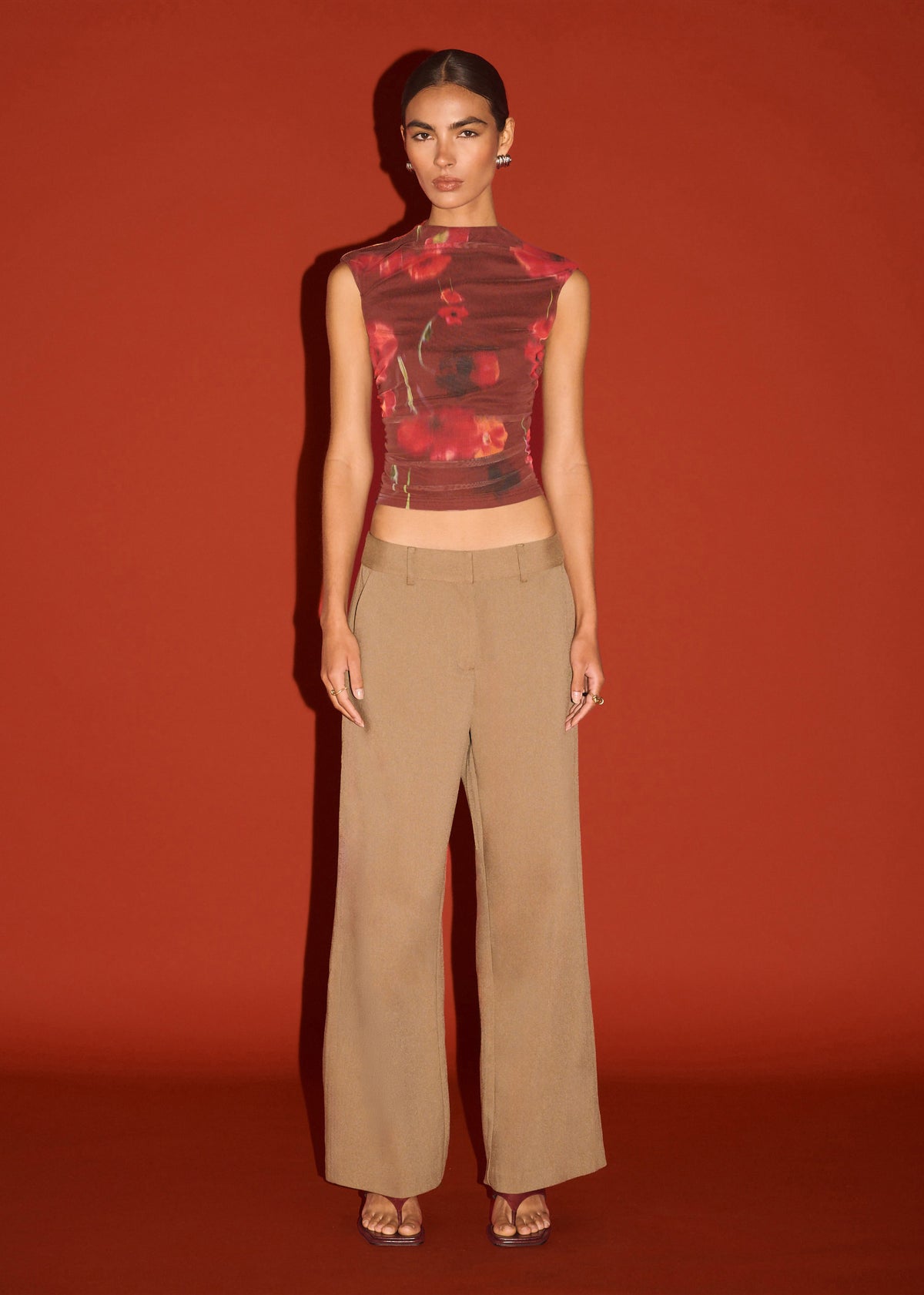 Model wearing Red Poppy Print Mesh Tank with a ruched detailing through waist and a slim, body-skimming fit.