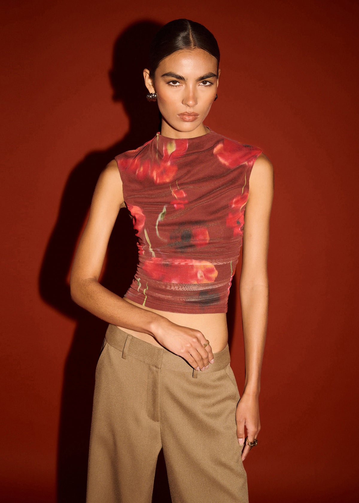 Close-up of Red Poppy Print Mesh Tank with a high neckline silhouette and a stretch mesh fabrication.