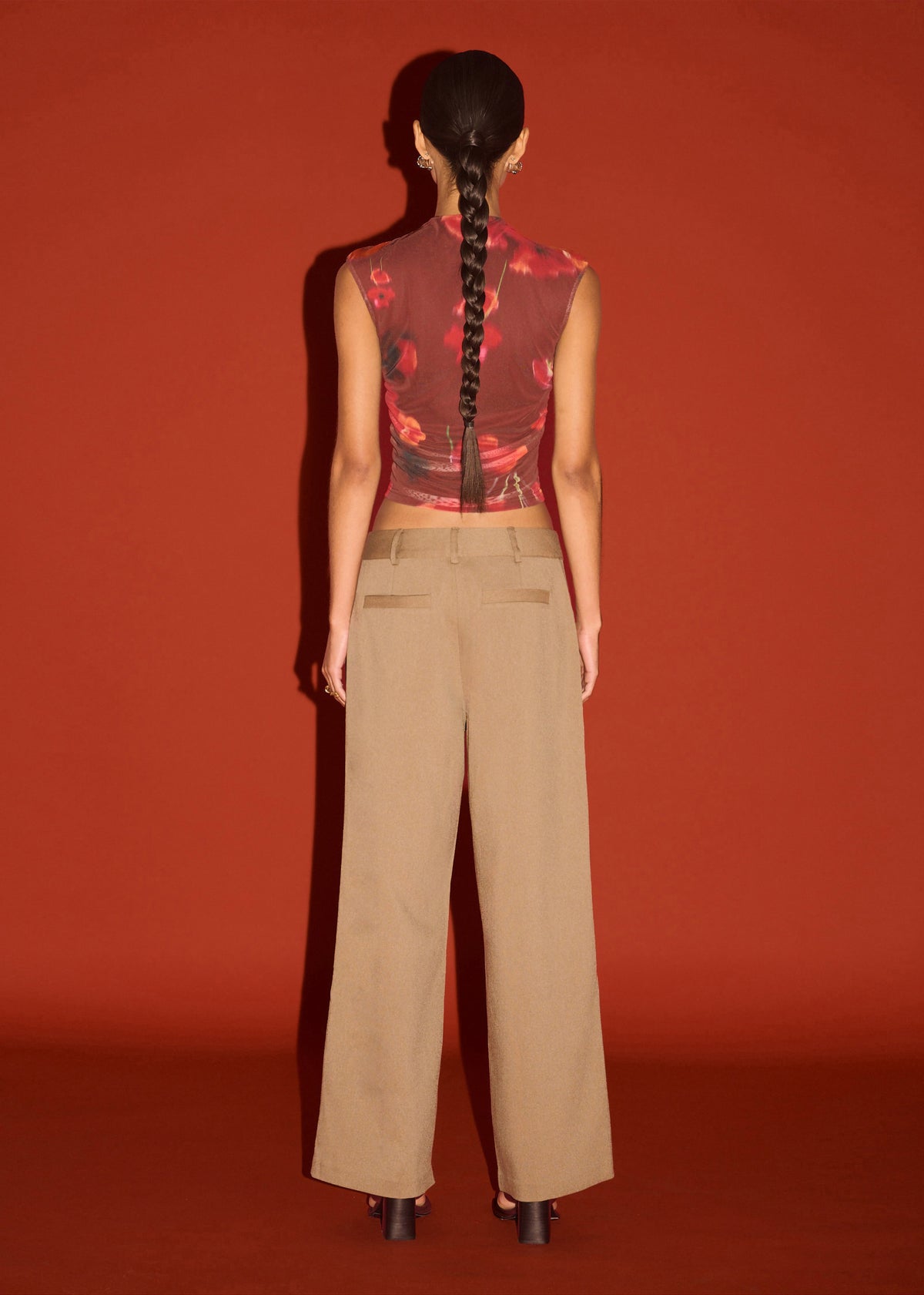 Back view of the Red Poppy Print Mesh Tank with a stretch mesh fabrication and a high neckline silhouette.
