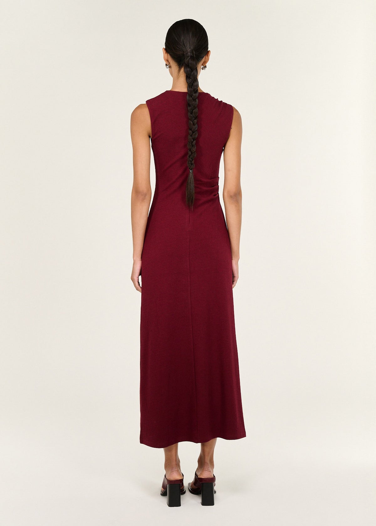 Back view of the Red Stretch Jersey Midi Dress with a crew neckline and an asymmetric gathered shoulder with ring detail.