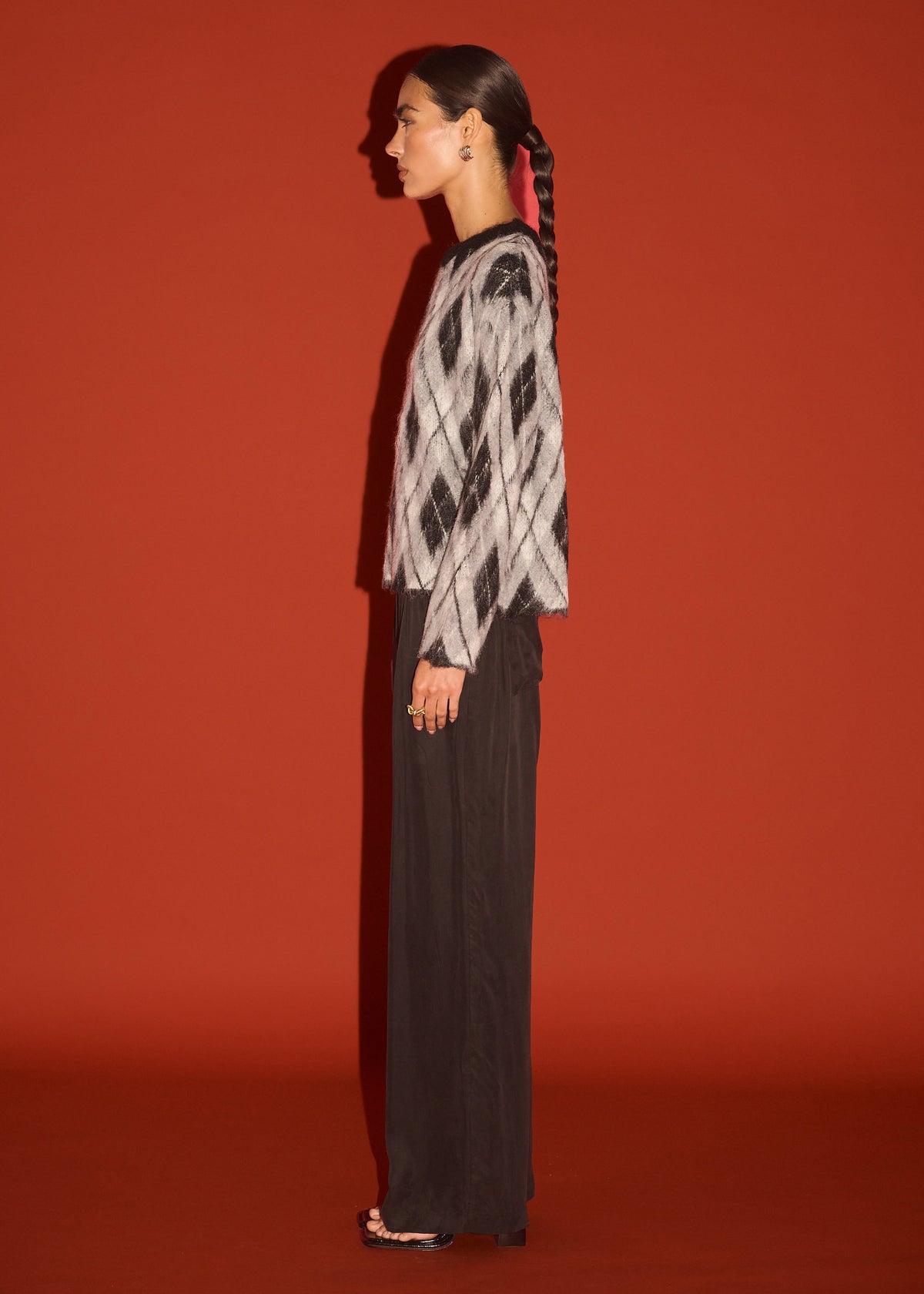 Side view of the Relaxed Fit Argyle Brushed Jumper, showing a soft brushed knit fabrication and an argyle pattern design.