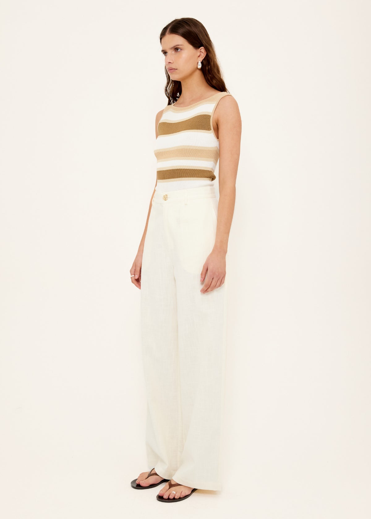 Side view of the Reversible Stripe Knit Tank, showing a medium-weight stretch knit and a fitted silhouette.