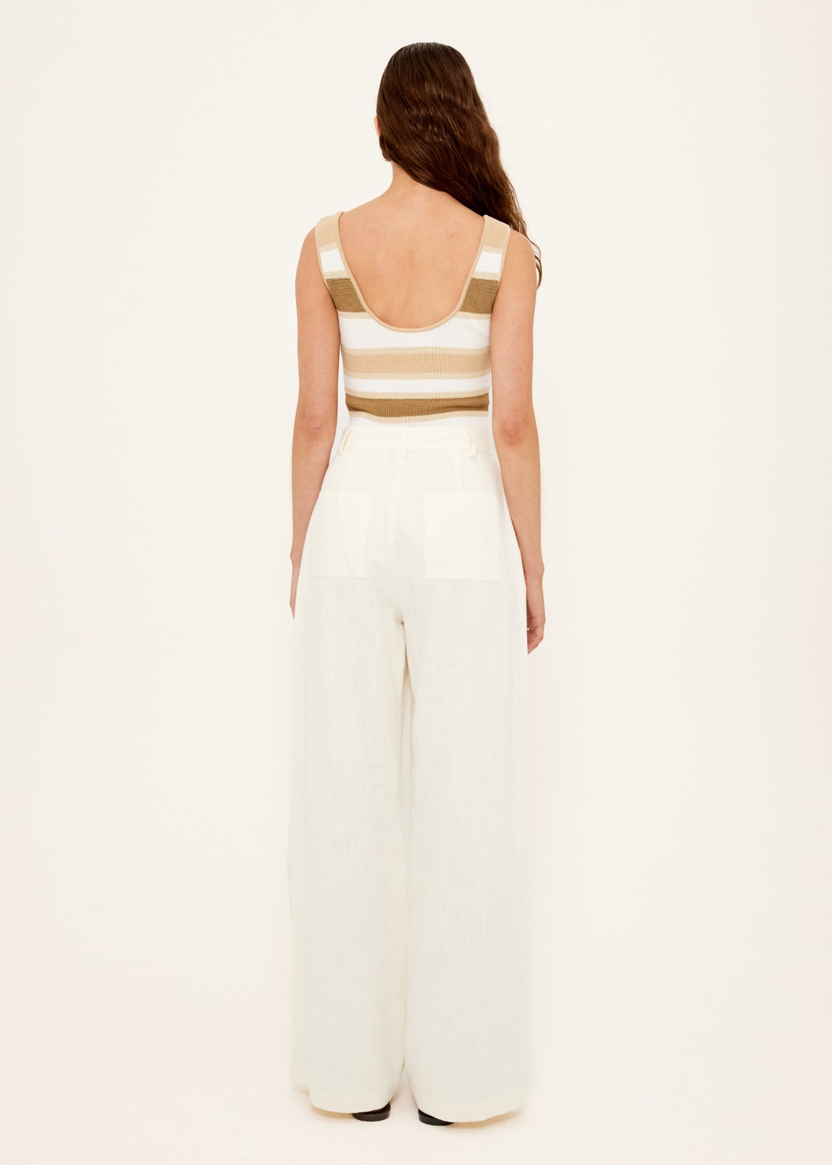 Back view of the Reversible Stripe Knit Tank with a scoop back neckline and a fitted silhouette.