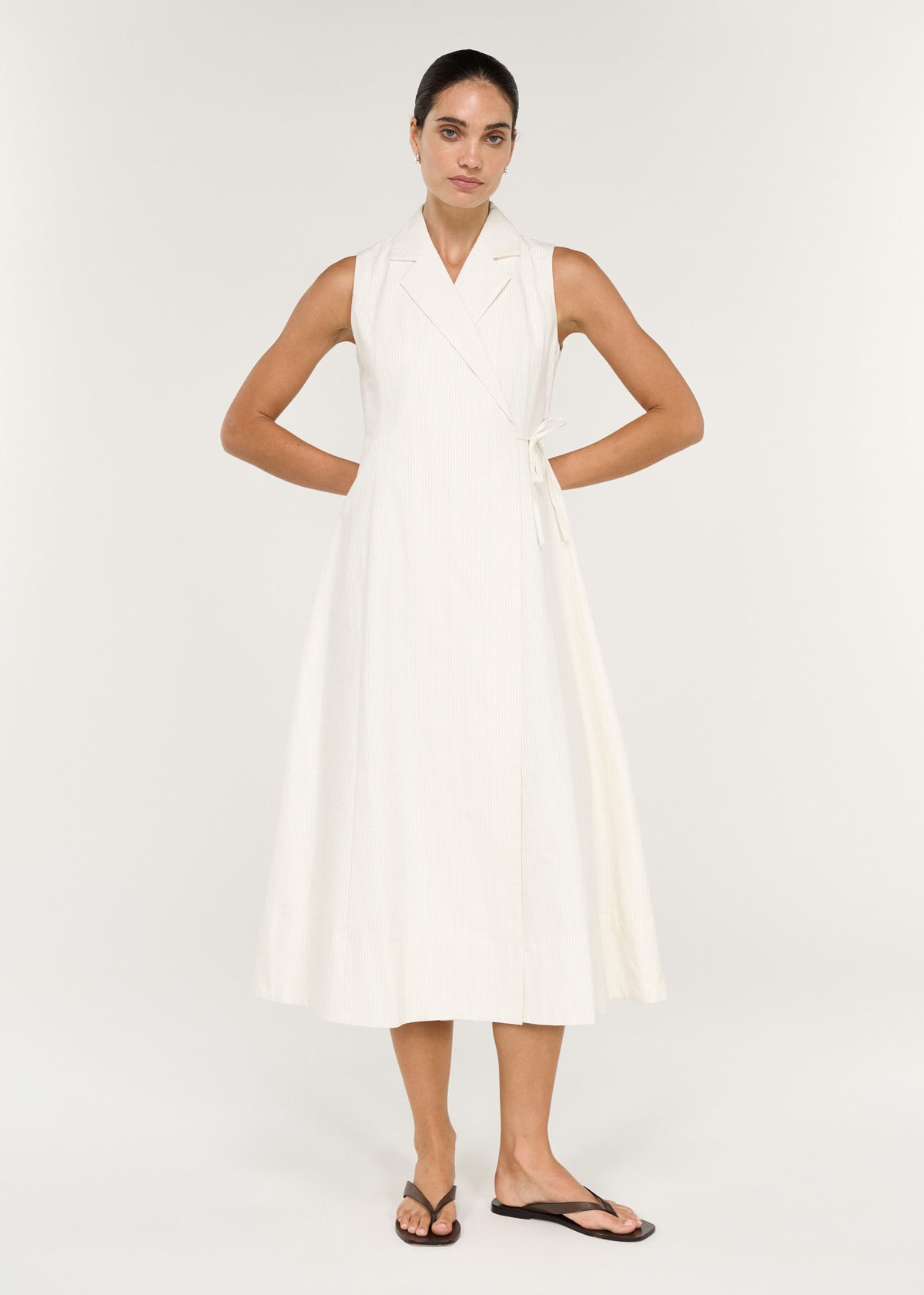Cotton Blend Wrap Detail Midi Dress on a model featuring a sleeveless silhouette and adjustable side tie.