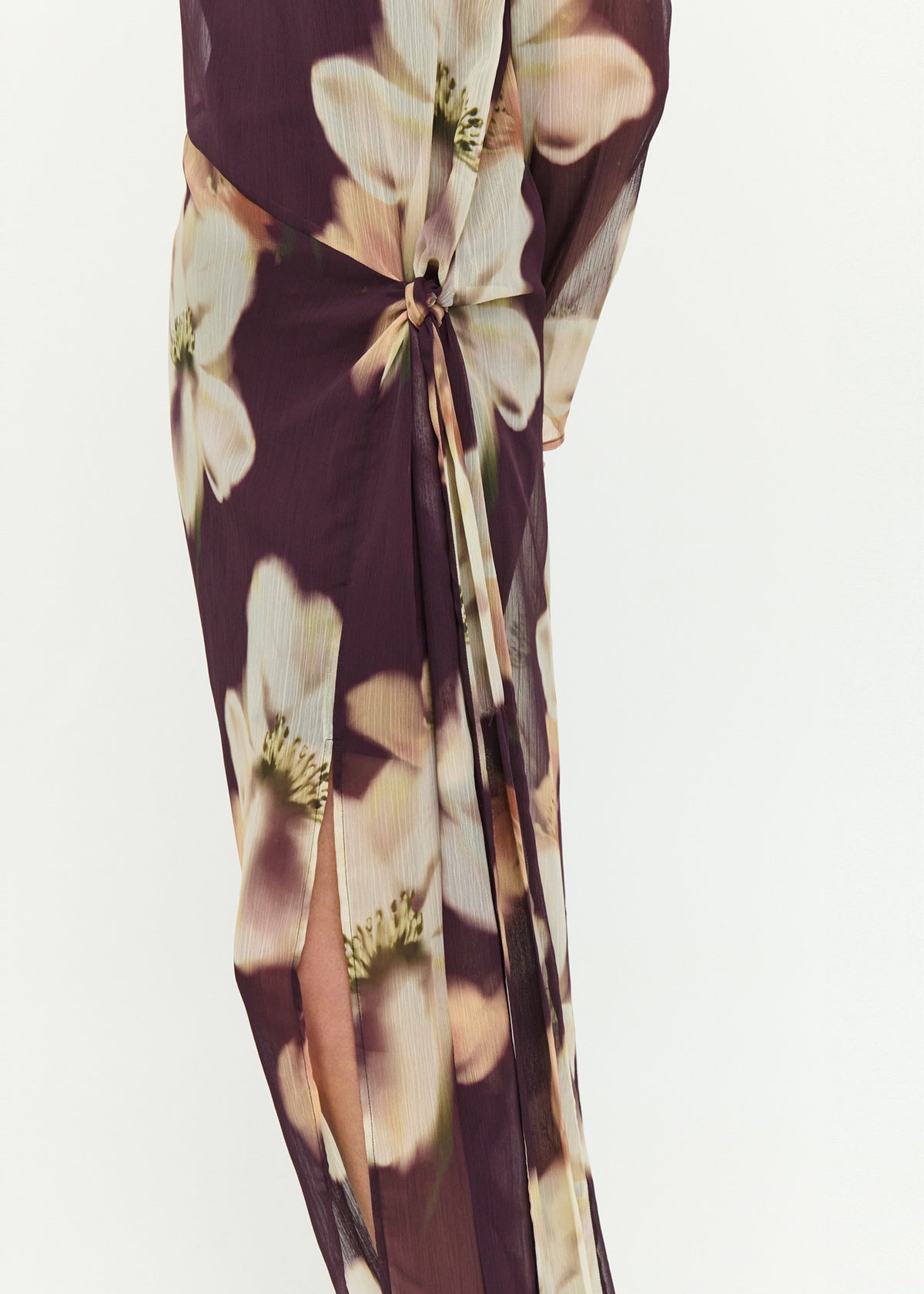 Close-up detail of the Sheer Floral Maxi Dress with Tie Detail, showing knotted tie.