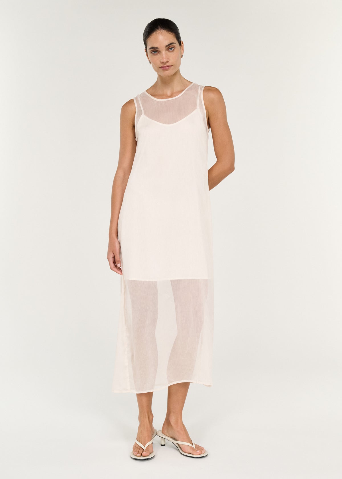 Model wearing Sheer Layered Slip Midi Dress in Cream, showing a relaxed straight silhouette and a round neckline.
