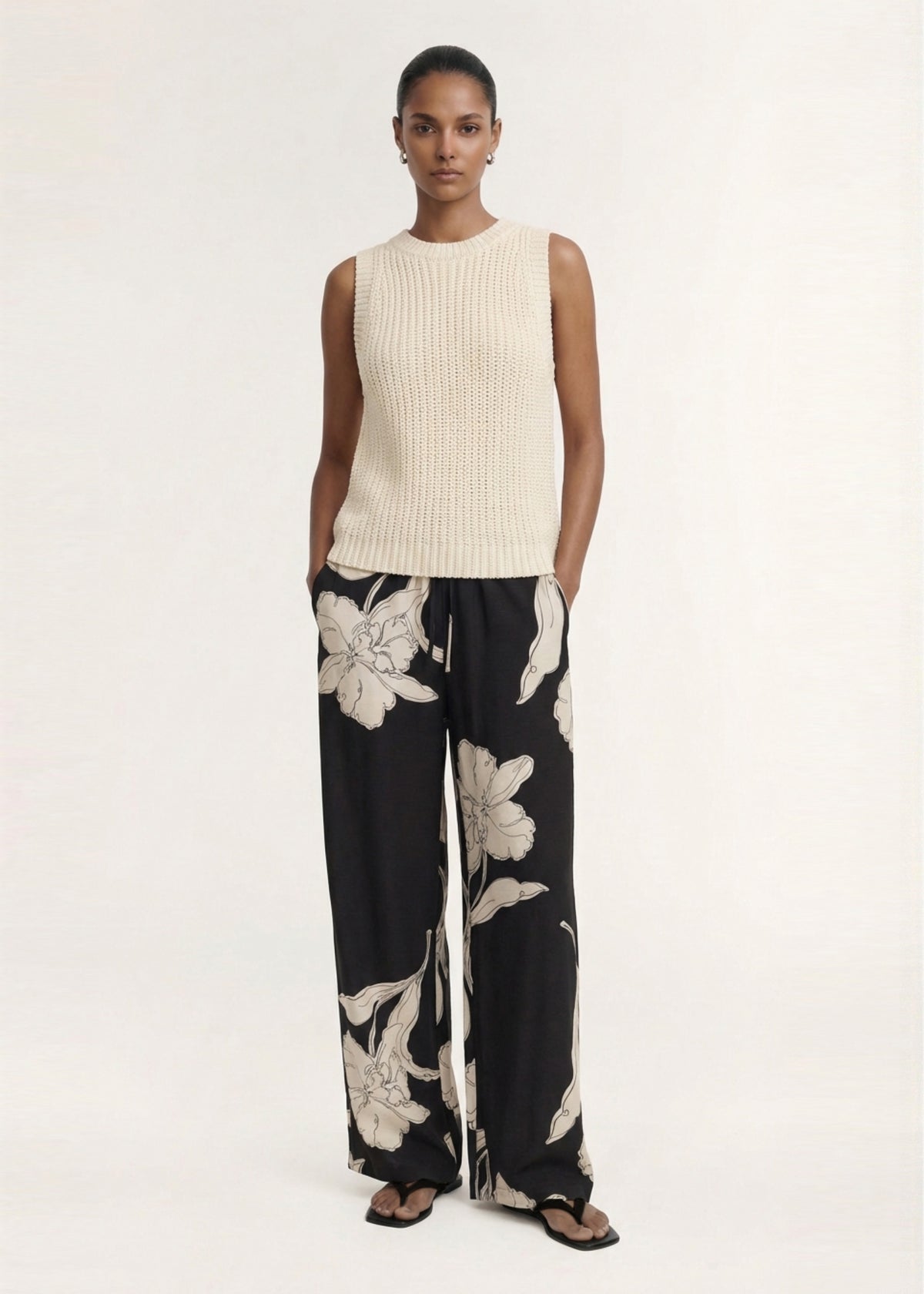 Model wearing Sketched Floral Drawstring Pant with a lightweight woven fabrication and an exclusive oversized floral print.