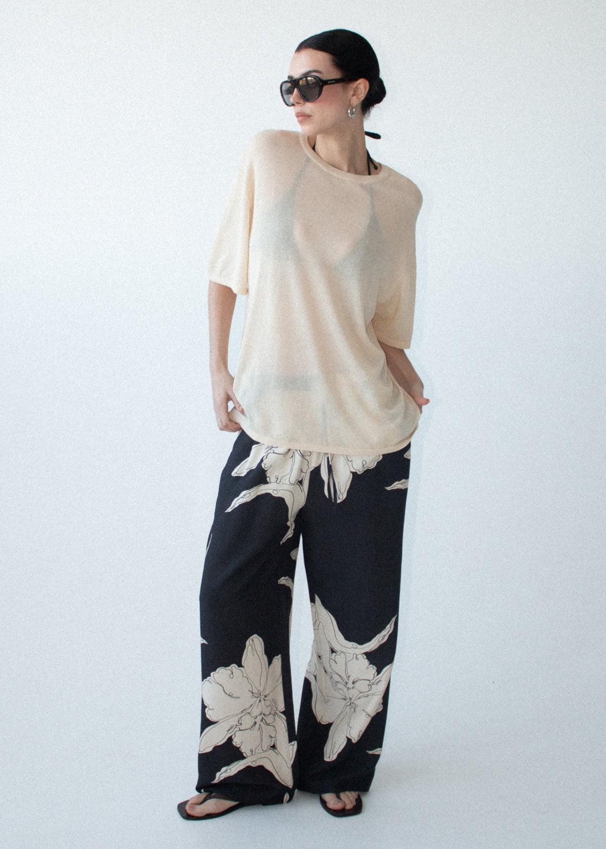 Model wearing Sketched Floral Drawstring Pant, showing a relaxed wide-leg silhouette and an elasticated waistband.