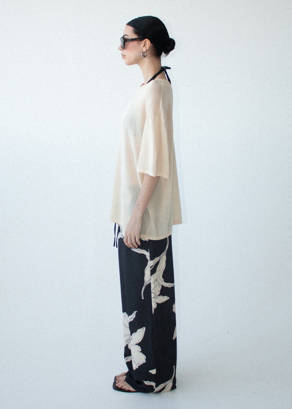 Side view of the Sketched Floral Drawstring Pant, showing a full length fit and a pull-on style.