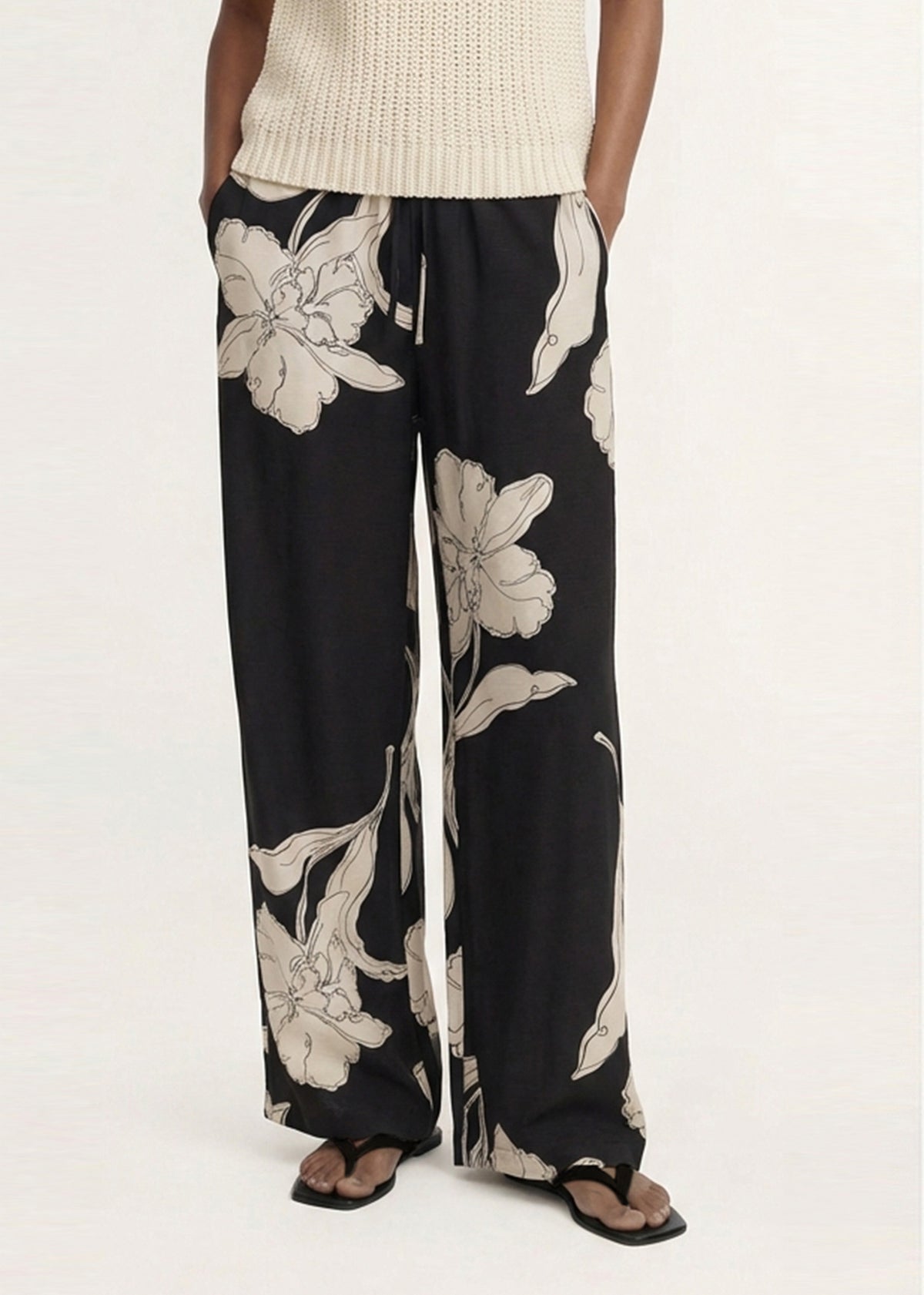 Model wearing Sketched Floral Drawstring Pant with a relaxed wide-leg silhouette and an elasticated waistband.