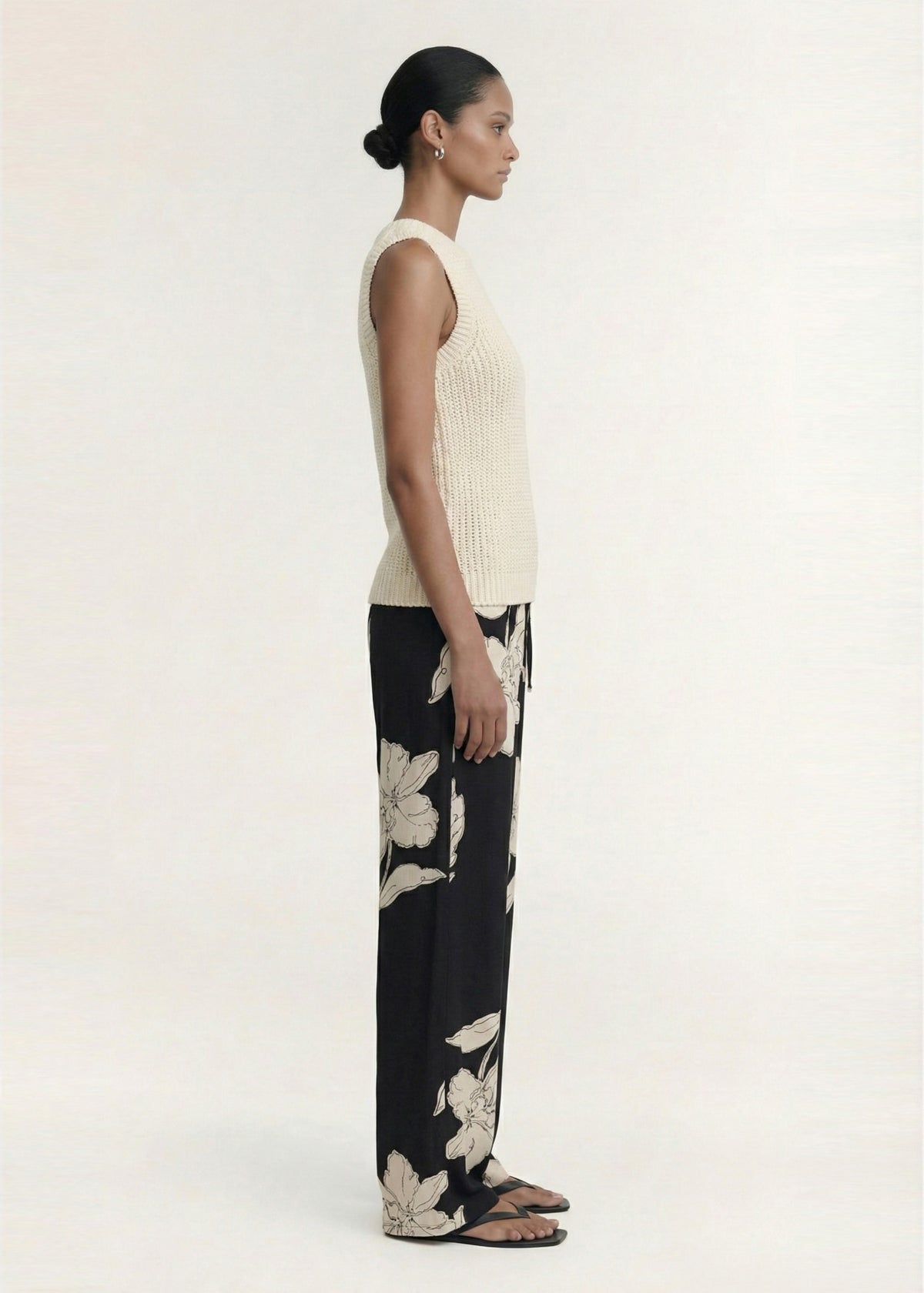 Side profile of the Sketched Floral Drawstring Pant with an adjustable drawcord tie and side seam pockets.