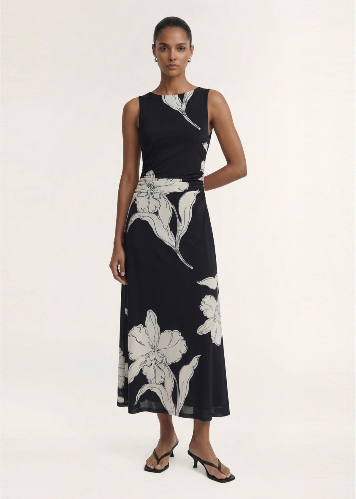 Model wearing Sketched Floral Mesh Midi Dress with a printed stretch mesh fabrication and an oversized floral print.