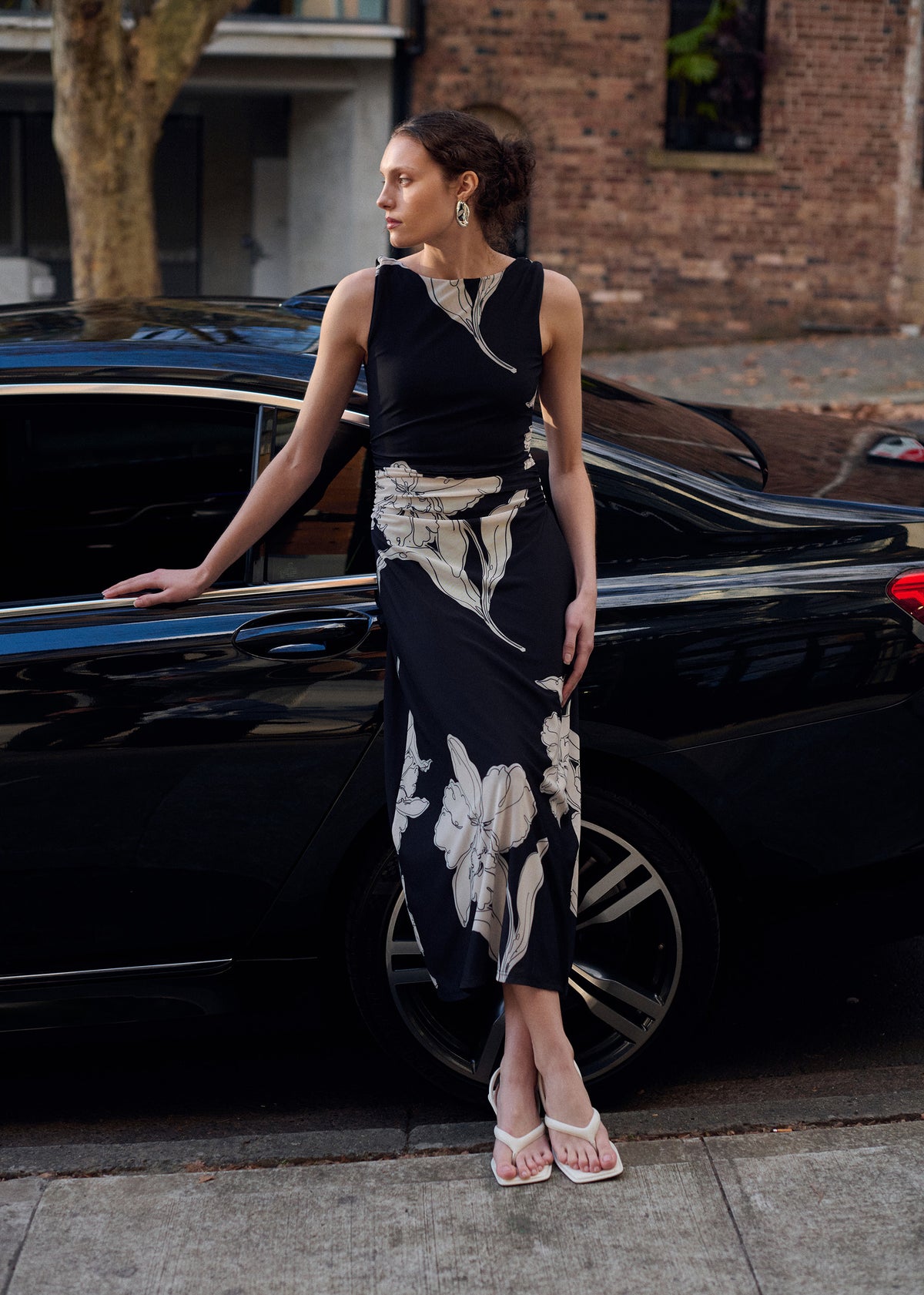 Model wearing Sketched Floral Mesh Midi Dress, showing a fitted bodice silhouette and a sleeveless cut.