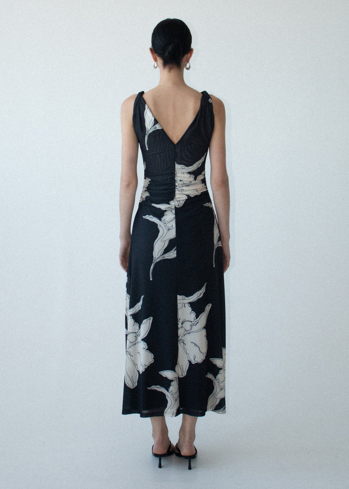 Back view of the Sketched Floral Mesh Midi Dress with a low back detail and a printed stretch mesh fabrication.