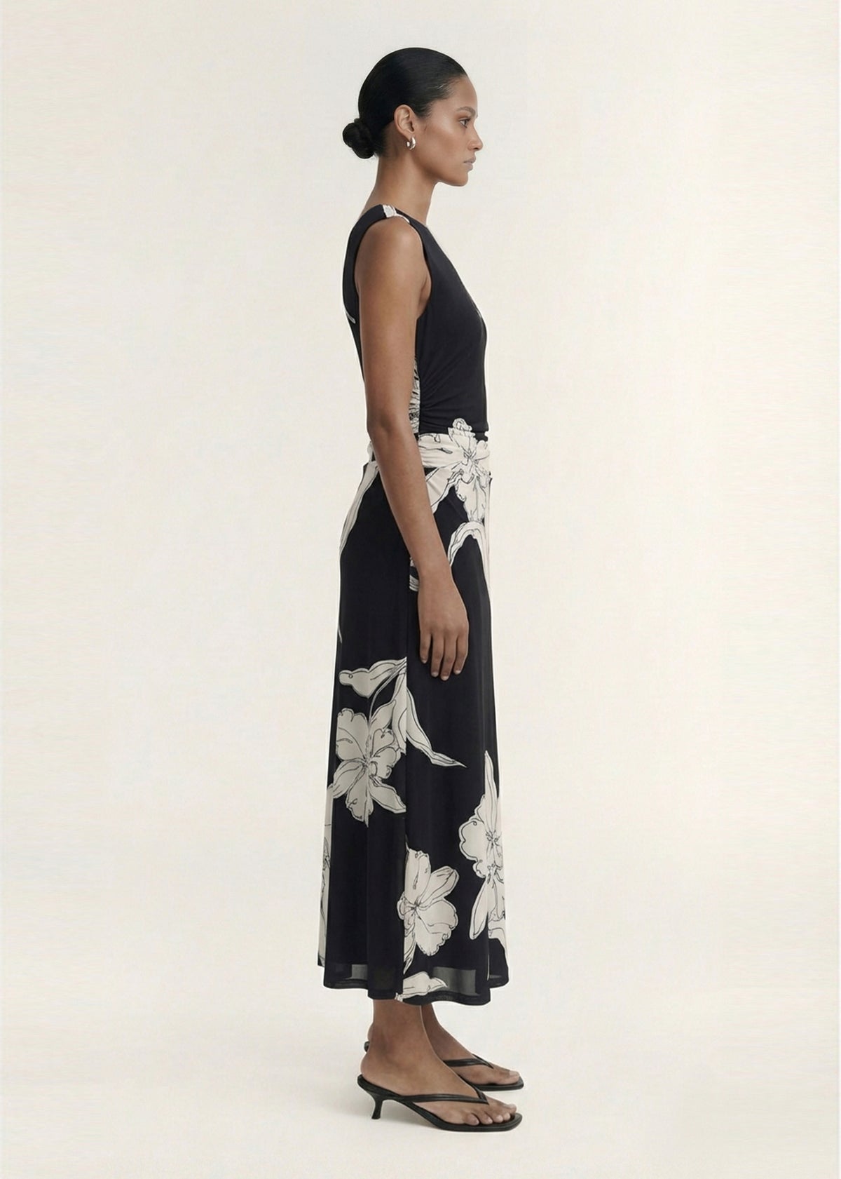 Side view of the Sketched Floral Mesh Midi Dress, showing a ruched waist detailing and a lightweight mesh finish.