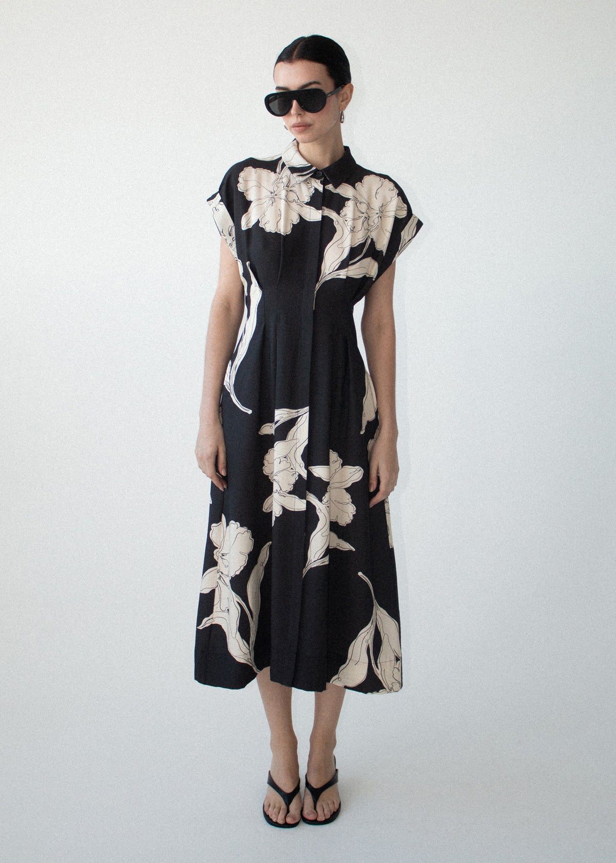Model wearing Sketched Floral Midi Shirt Dress, showing a collared neckline and a concealed button front closure.