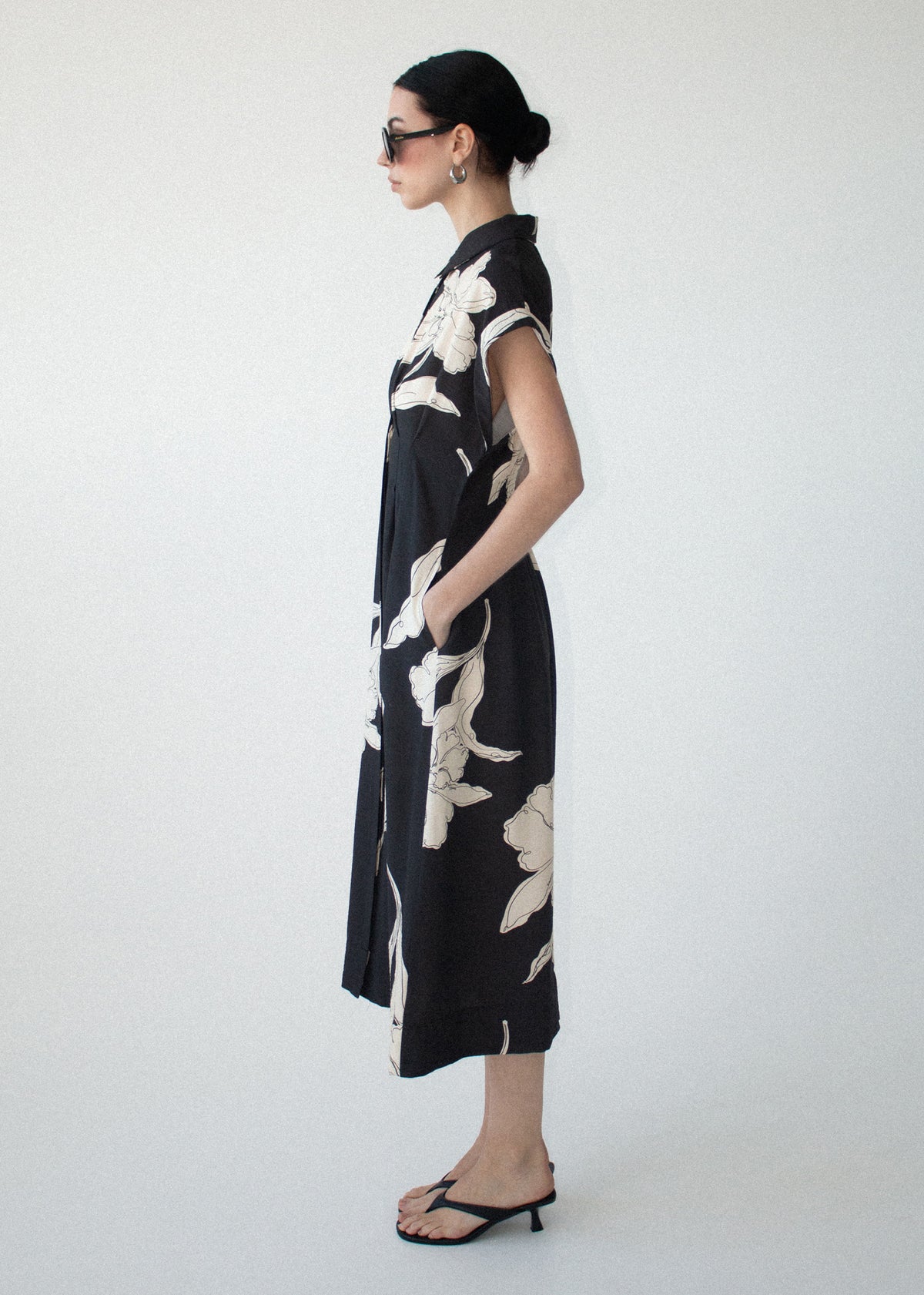 Side view of the Sketched Floral Midi Shirt Dress, showing cap sleeves and a softly tailored waist detailing.