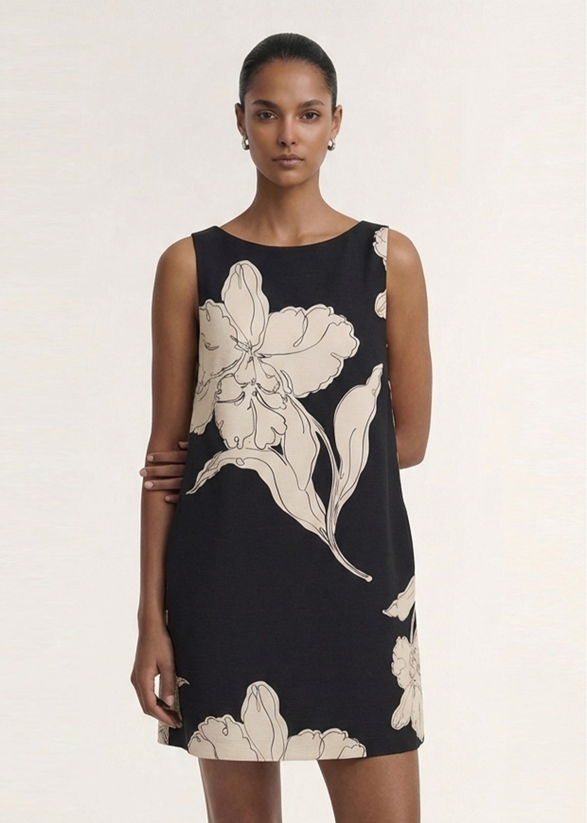 Close-up of the Sketched Floral Sleeveless Mini Dress, showing a collared neckline and a sleeveless cut.