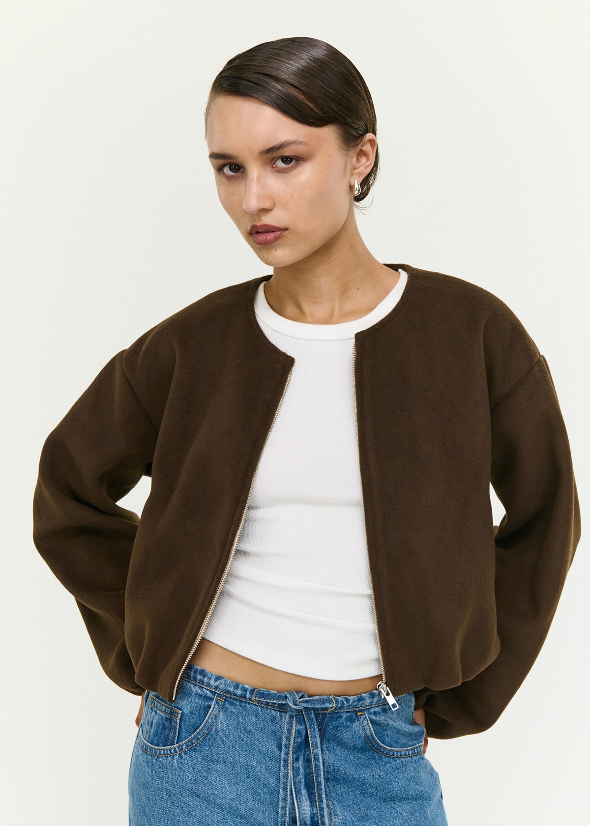 Close-up of the Soft Brushed Cropped Bomber Jacket, showing a collarless neckline and long balloon sleeves with elasticated cuffs.