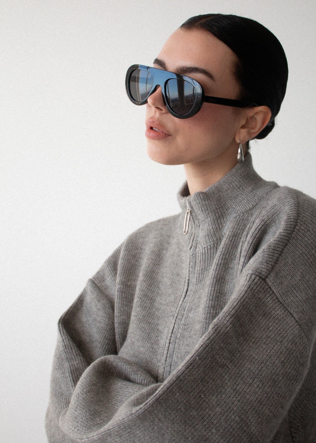 Close-up detail of the Soft Grey Oversized Zip Cardigan, showing sleeve and shoulder.