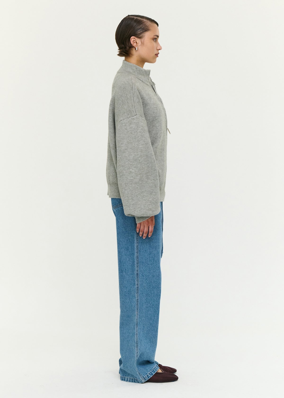 Side view of the Soft Grey Oversized Zip Cardigan, showing a ribbed cuffs and hem.