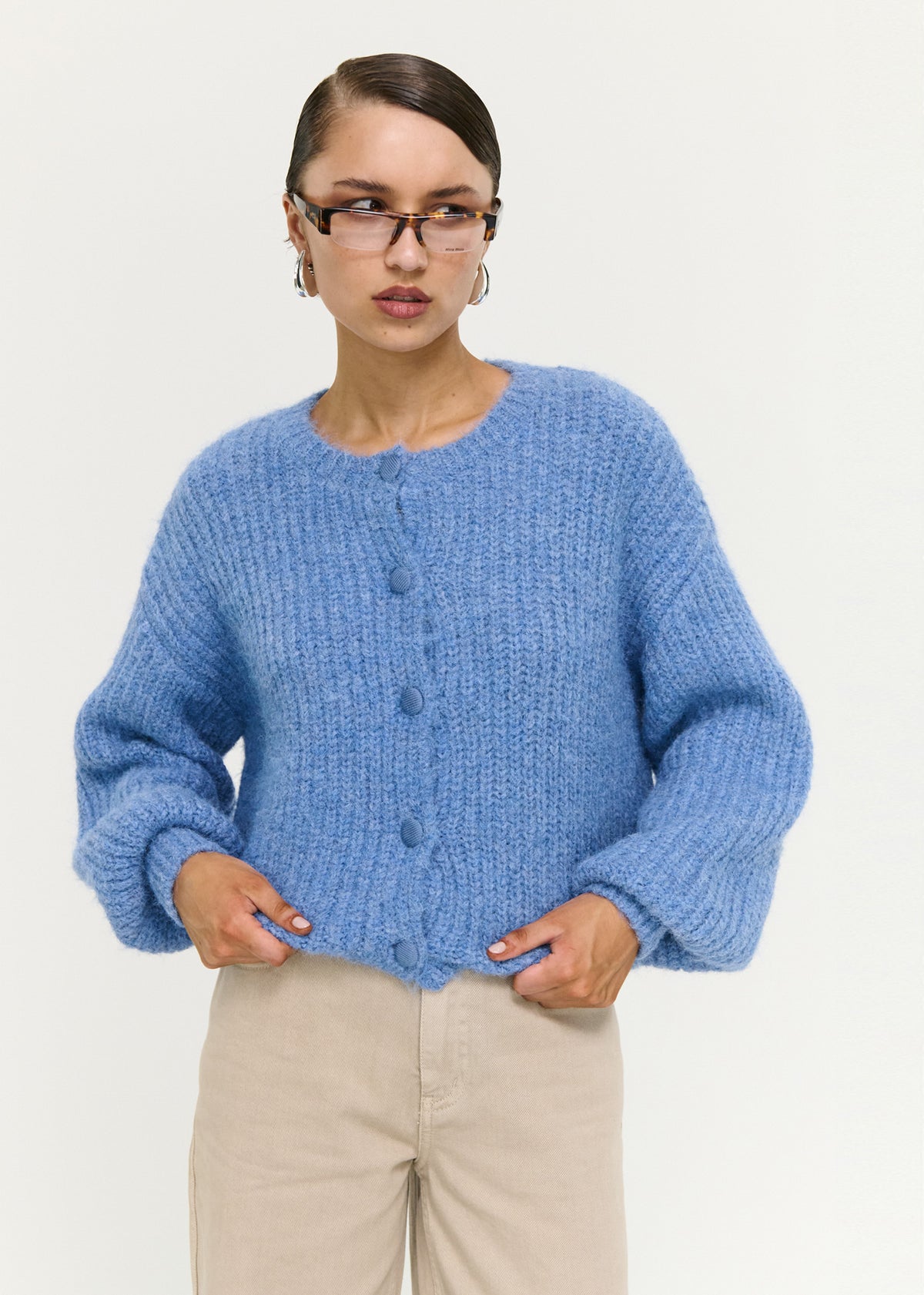 Close-up of the Soft Handle Balloon Sleeve Cardigan in Blue, showing a button-through front and a round neckline.