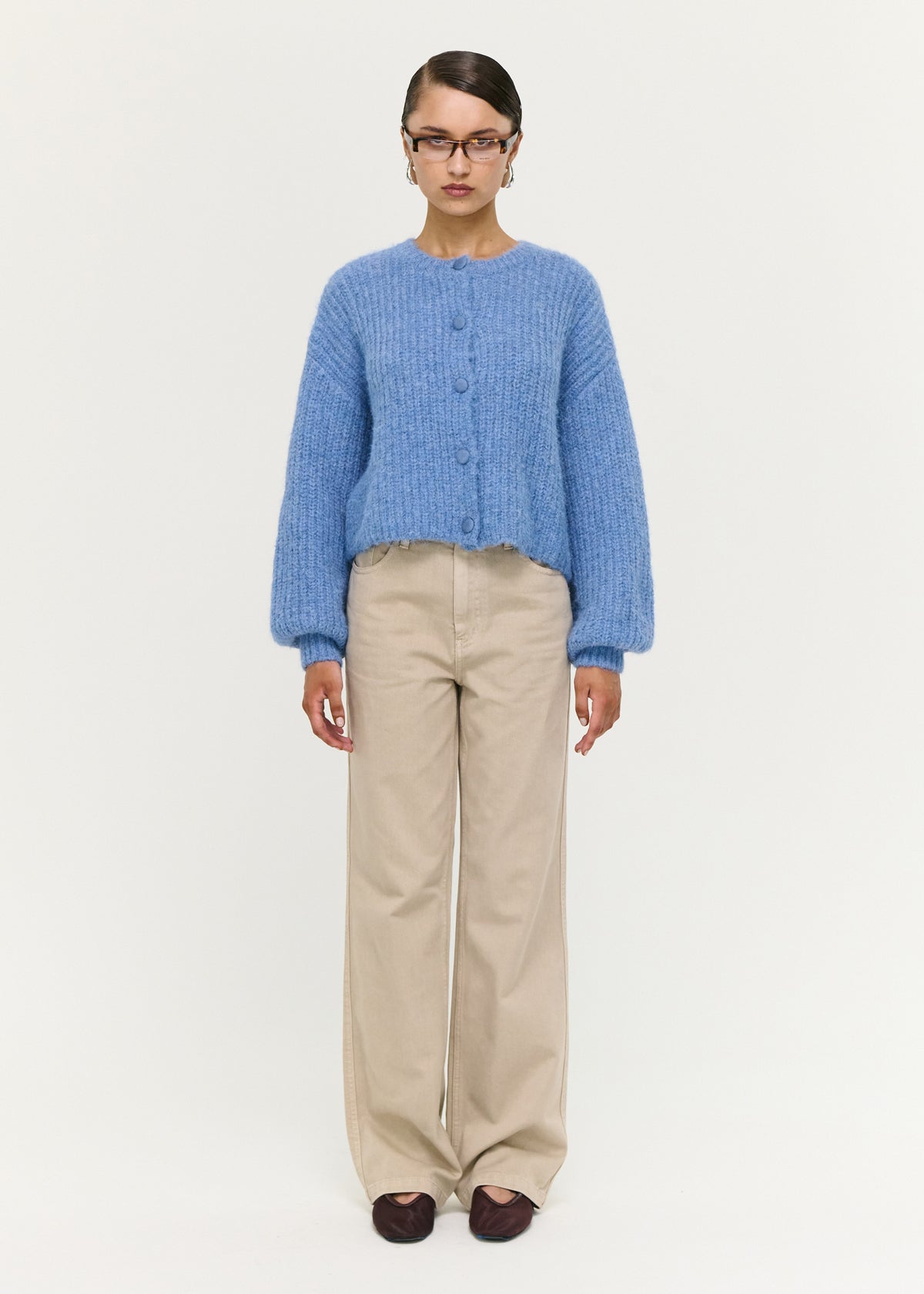 Model wearing Soft Handle Balloon Sleeve Cardigan in Blue with a button-through front and a round neckline.