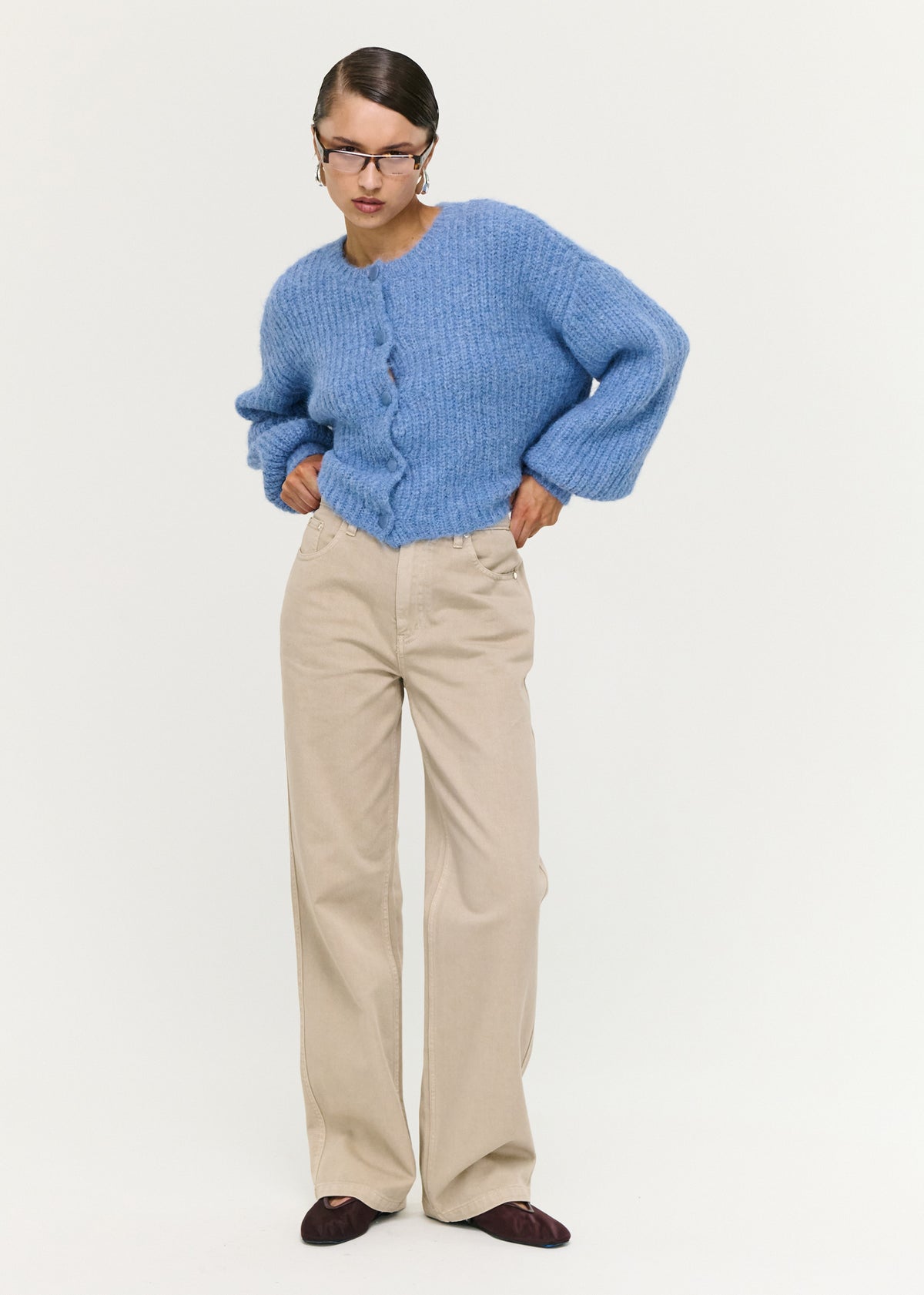 Close-up of Soft Handle Balloon Sleeve Cardigan in Blue with a button-through front and a round neckline.