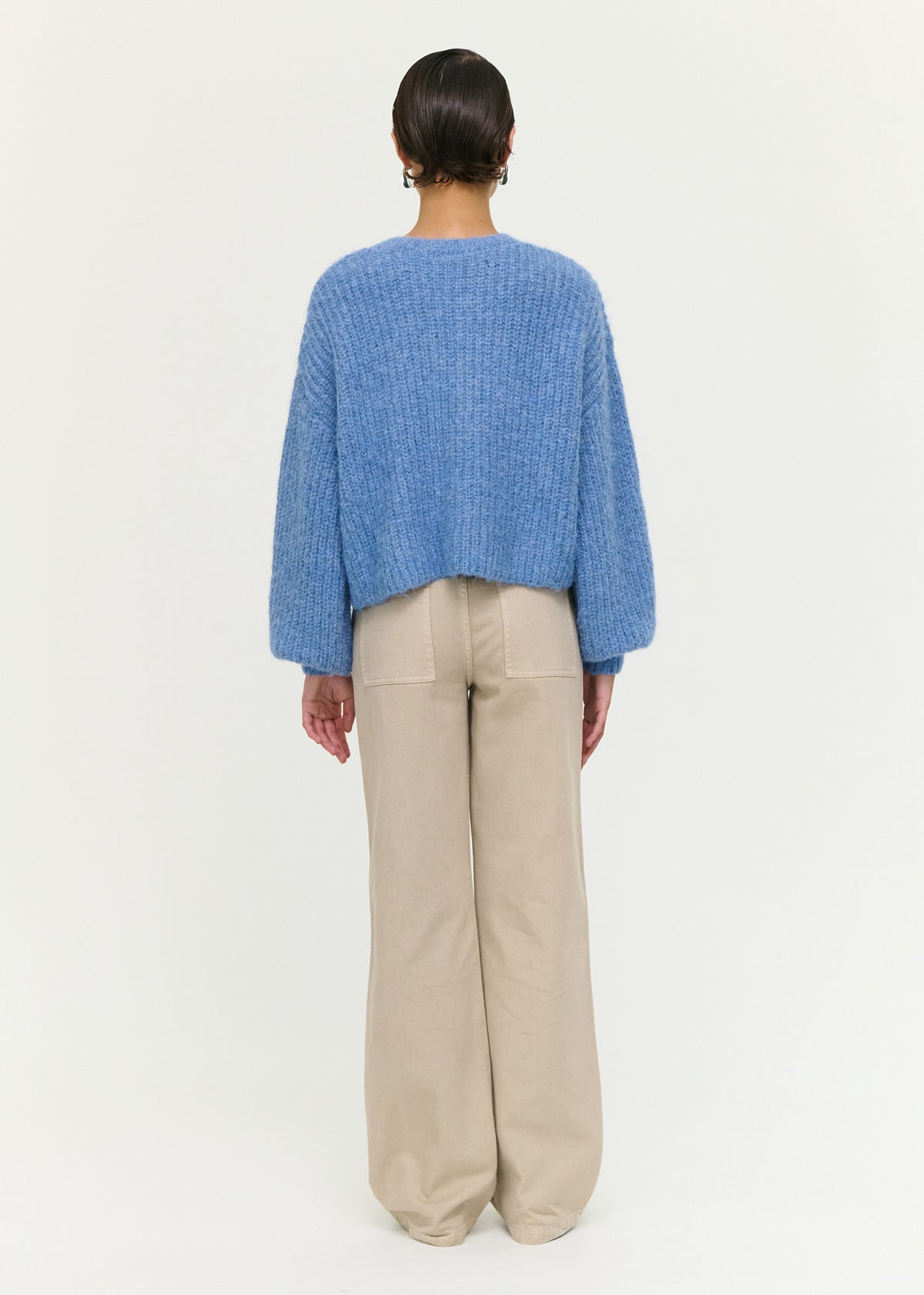 Back view of the Soft Handle Balloon Sleeve Cardigan in Blue with a button-through front and a soft fluffy knit fabrication.