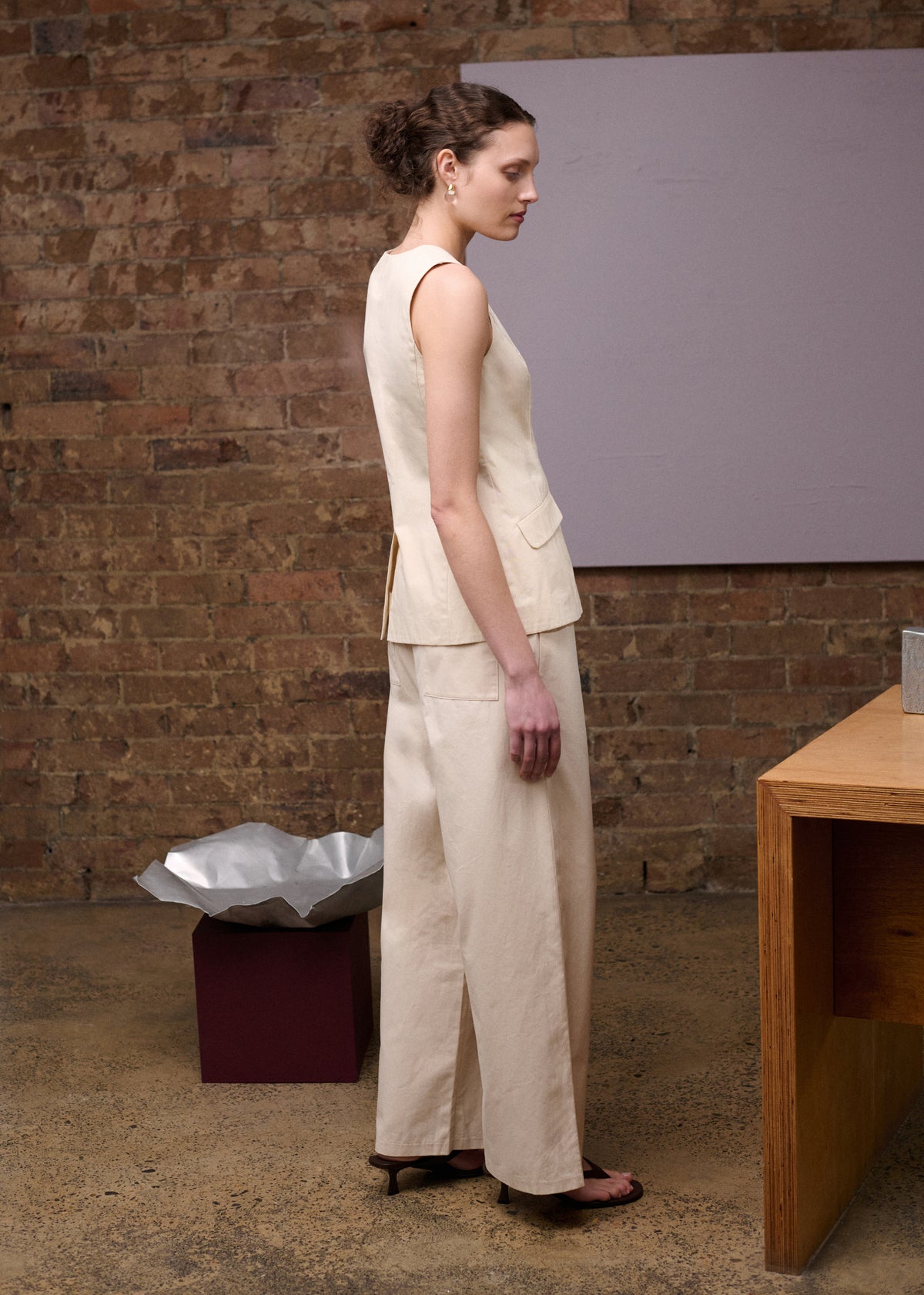 Side view of the Stone Cotton Wide Leg Drawstring Pant, showing a lightweight woven fabrication and an elasticated drawstring waist.