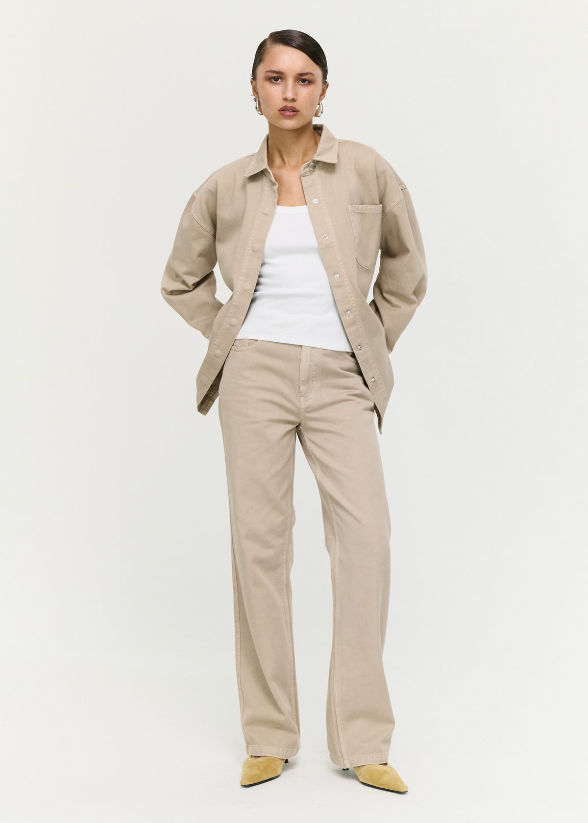 Model wearing Stone Wash Relaxed Denim Shacket, showing a button-through front and a classic collar.