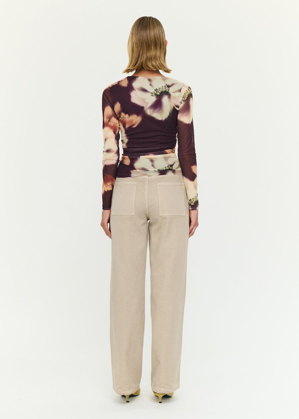 Back view of the Stone Wash Straight Leg Jeans with a zip fly with button closure and a high rise fit.