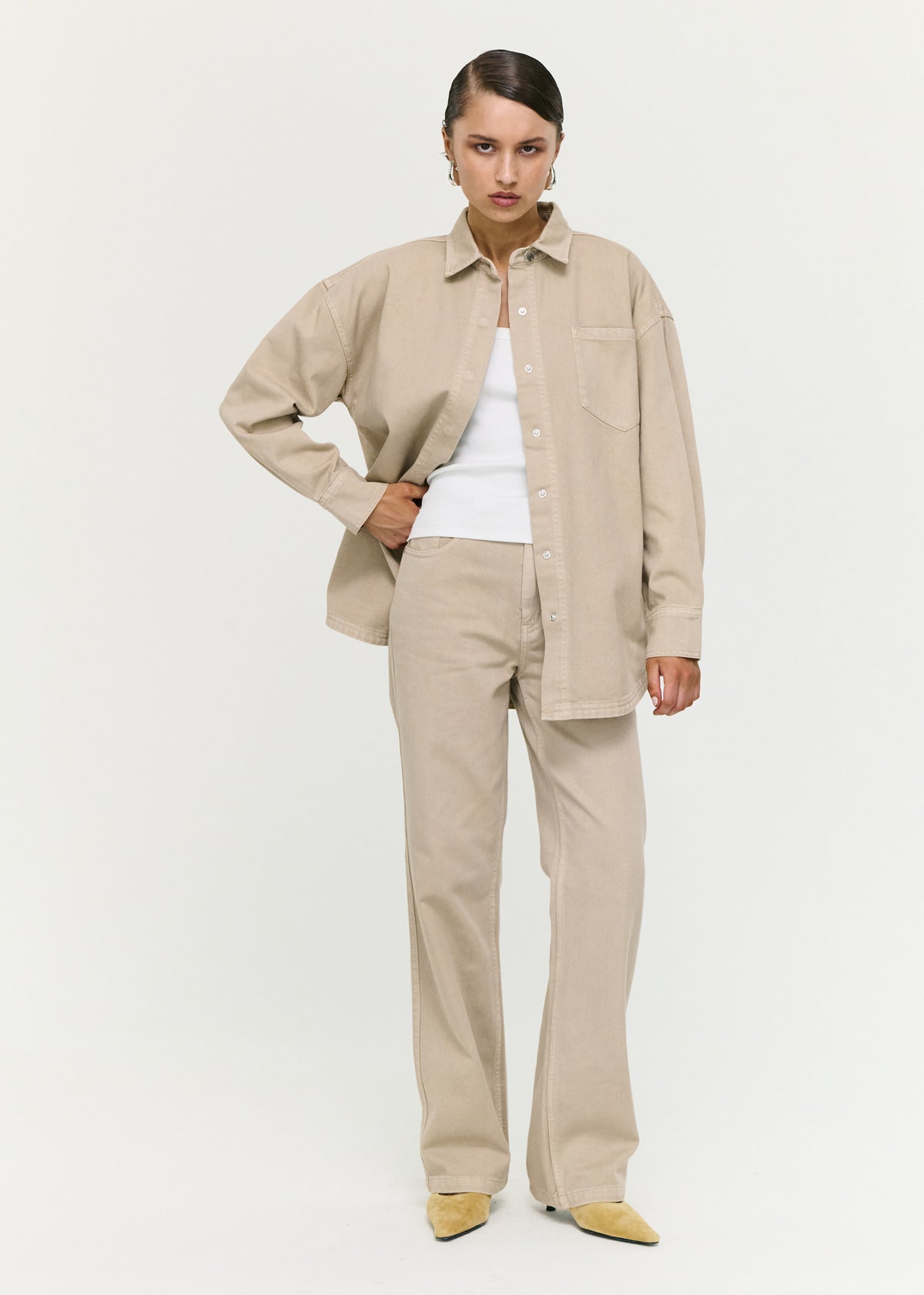 Model wearing Stone Wash Straight Leg Jeans, showing a full length and a neutral wash.