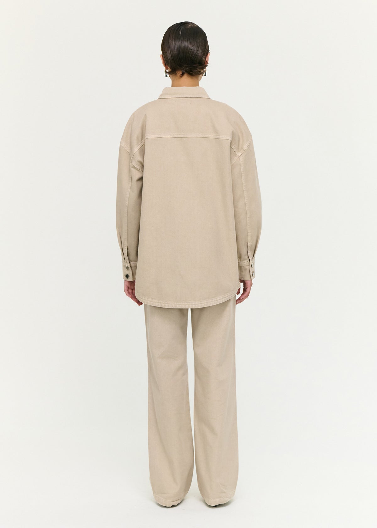 Back view of the Stone Wash Straight Leg Jeans, showing a zip fly with button closure and a high rise fit.