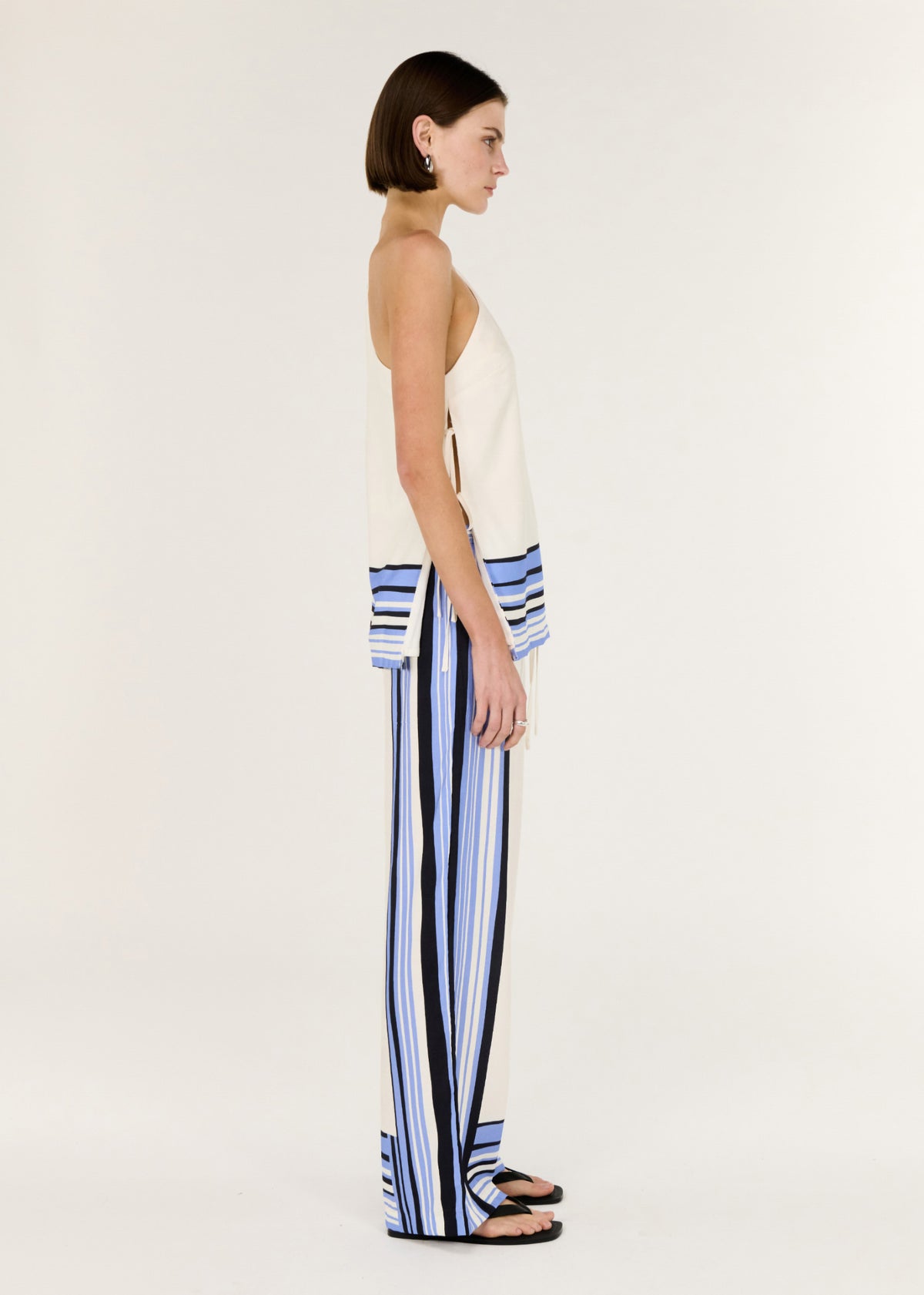 Side view of the Stripe Relaxed Wide-Leg Low Rise Pants, showing a comfortable pull-on waist and a fluid drape with soft structure.