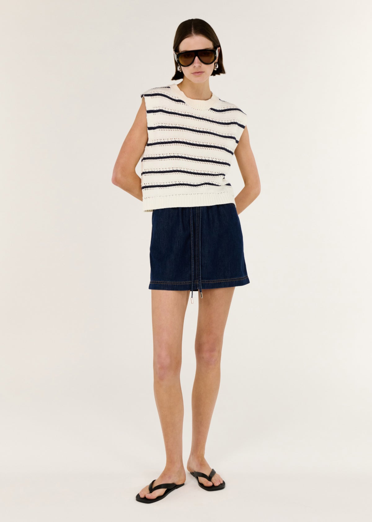 Model wearing Striped Cotton Blend Knit Tank, showing a ribbed neckline and hem.