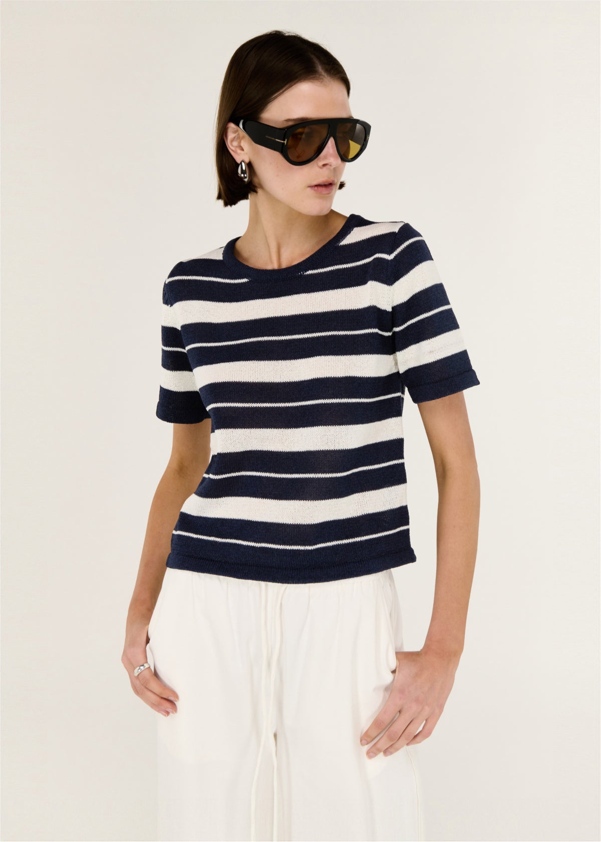 Close-up of the Striped Crew Neck Knit Tee, showing short sleeves and a classic crew neckline.