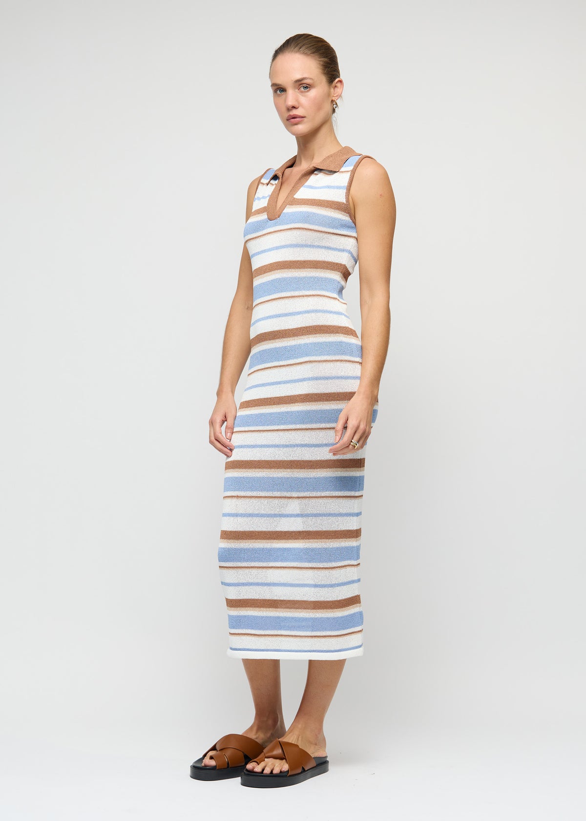Model wearing Striped Knit Midi Dress, showing a textured stripe knit pattern and a midi length.