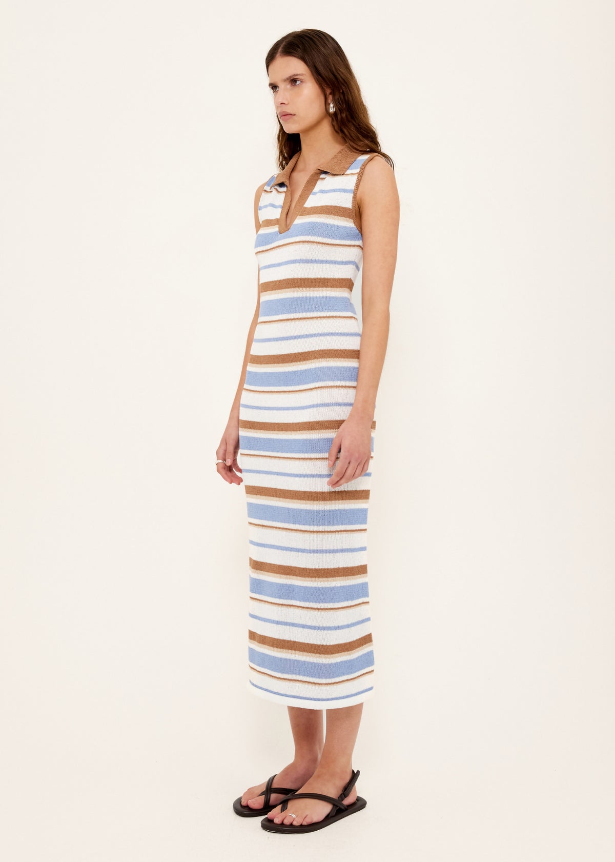 Side view of the Striped Knit Midi Dress, showing a textured stripe knit pattern and a midi length.