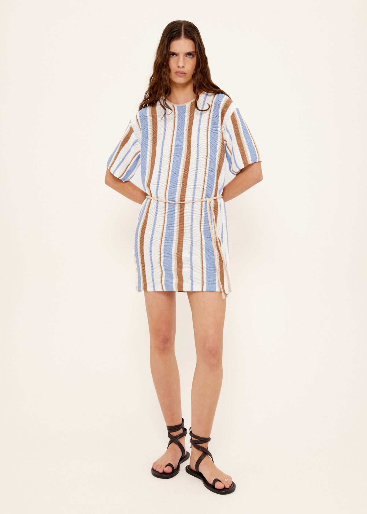Model wearing Striped Knit T-Shirt Mini Dress, showing a mini length and a relaxed T-shirt silhouette.