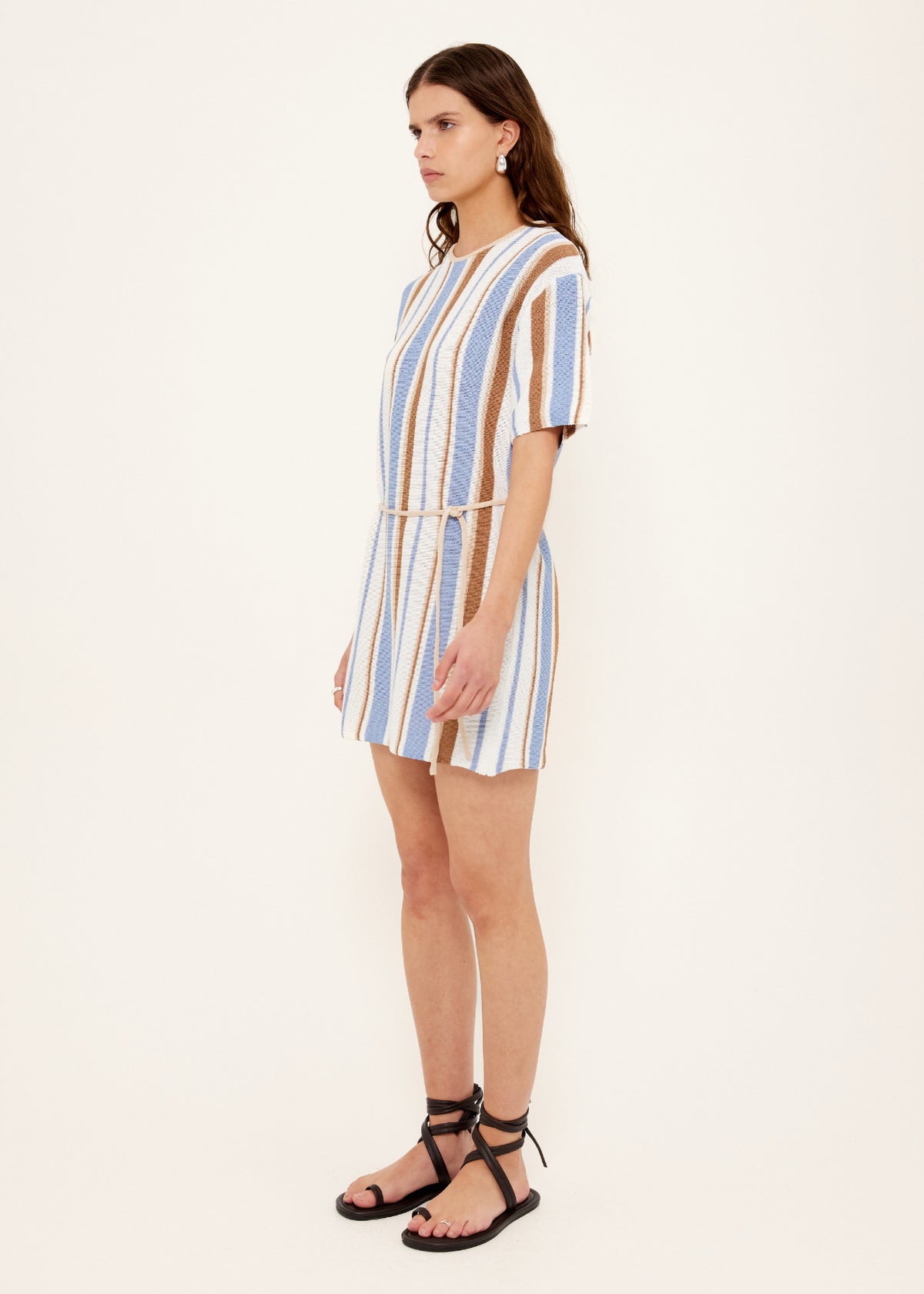 Side view of the Striped Knit T-Shirt Mini Dress, showing a removable waist tie and crew neckline with short sleeves.