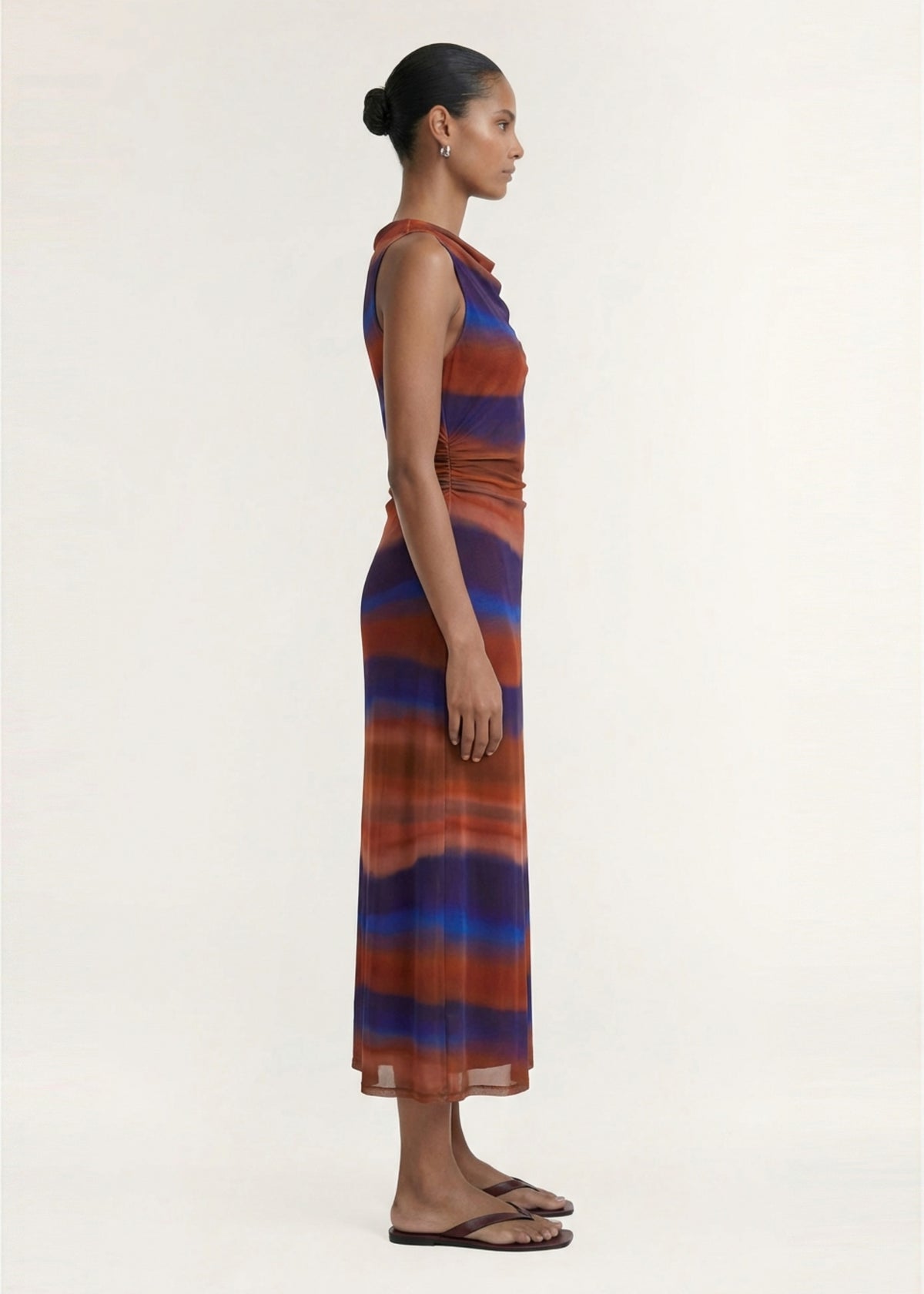 Side view of the Sunset Ombre Print Sleeveless Mesh Midi Dress, showing a high round neckline and a softly draped front detail.