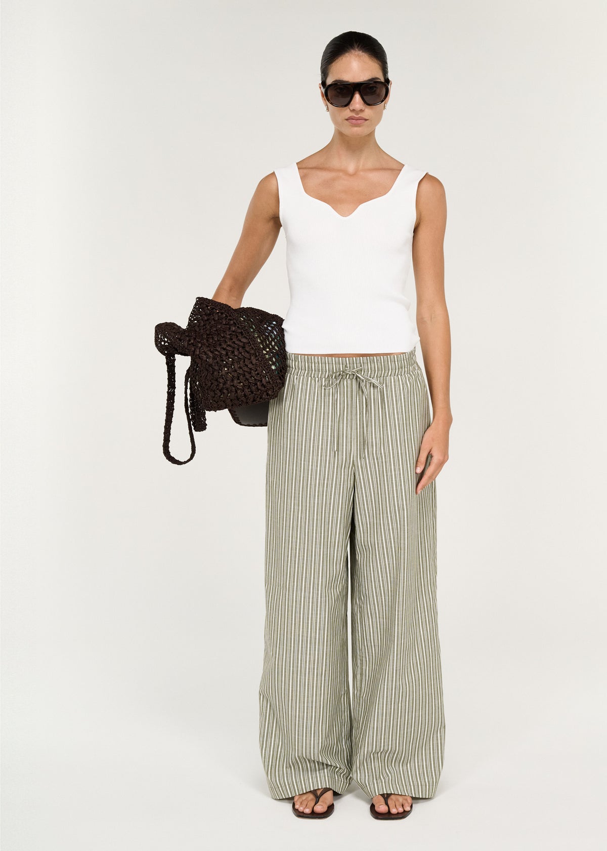 Model wearing Sweetheart Rib Knit Tank in White, showing a sweetheart neckline and wide shoulder straps.