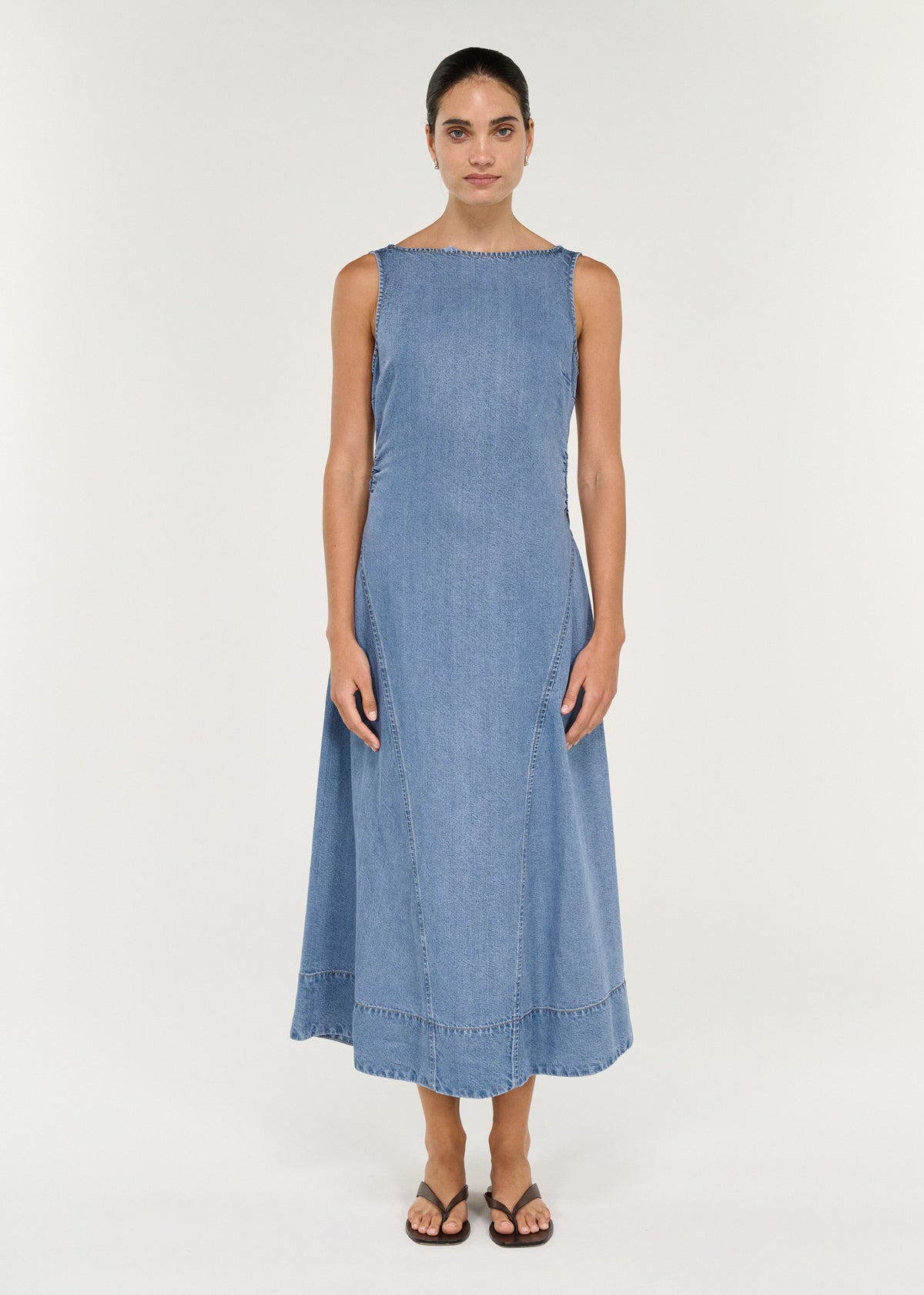 Chambray Denim Sleeveless Midi Dress showcasing a fitted bodice and flowing A-line skirt.