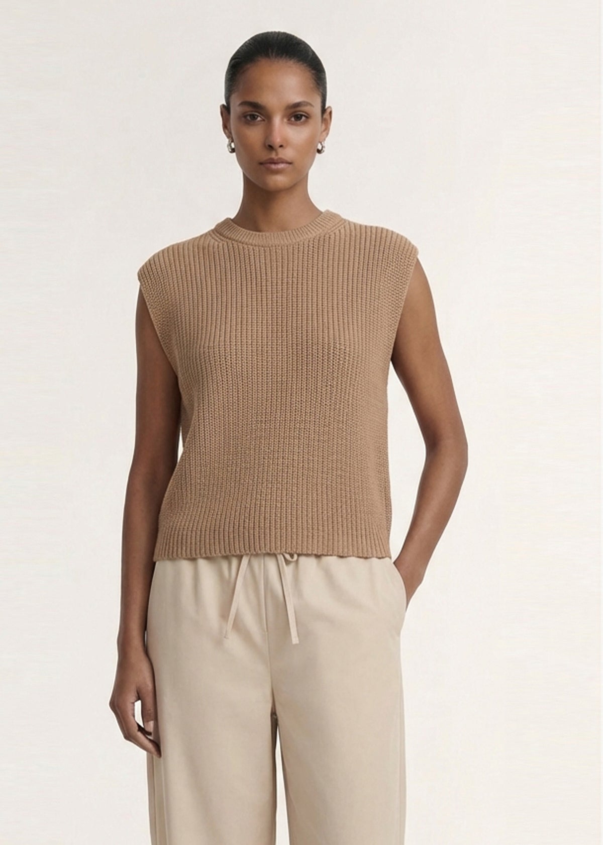 Close-up of the Taupe Cotton Blend Knit Tank Top, showing a sleeveless silhouette and a crew neckline.